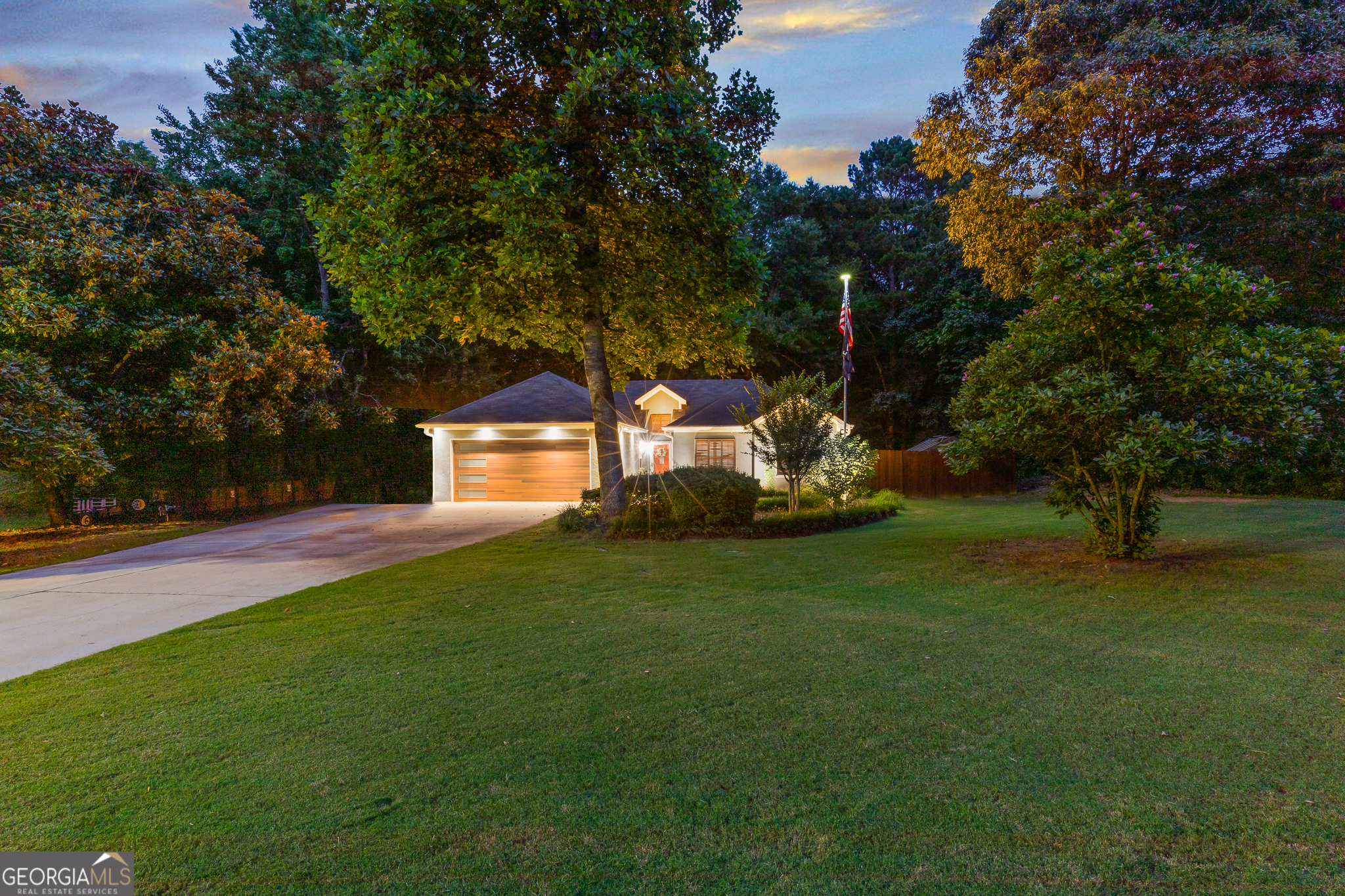 Meticulously renovated 3br 2ba Ranch and situated on .805 acre private and fully fenced lot, this impressive home offers a wealth of contemporary features for the discerning buyer. The residence boasts all-luxury vinyl plank flooring throughout, a state-of-the-art modern kitchen, and elegantly renovated bathrooms. Residents will enjoy evenings on the expanded rear deck, while gardening enthusiasts can make full use of the dedicated planter beds and greenhouse. A 10 x 12 outbuilding adds valuable flexible space, and thoughtful enhancements include hurricane shutters, a new insulated modern garage door, architectural uplighting, and an extended driveway for ample parking. With the assurance of an adjacent unbuildable lot providing lasting privacy and no homeowners association to restrict your lifestyle.
