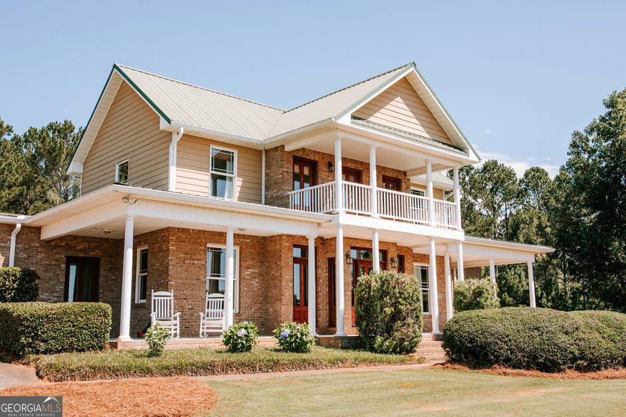 Expansive 4-Bedroom Estate on 37 Acres with Luxurious Finishes and Endless Potential. Welcome to your dream retreat! This stunning 4-bedroom, 5.5-bath home offers nearly 4,000 square feet of thoughtfully designed living space nestled on a breathtaking 37-acre parcel-perfect for nature lovers, hunters, or anyone seeking space and serenity. Step inside to a grand foyer with gleaming hardwood floors that flow into the formal dining room, kitchen, breakfast room, and hallway. The den, with its cozy wood-burning fireplace and plush carpeting, creates a perfect gathering space. The spacious master suite on the main floor features its own fireplace, a spa-like bathroom with a jetted jacuzzi tub, a separate tiled shower, and a generous walk-in closet. Adjacent to the master suite is an office. The kitchen is a chef's delight with cherry cabinetry, quartz countertops, and clever storage solutions throughout. The bright and airy breakfast room is lined with windows, flooding the space with natural light. Elegant crown molding, baseboards, and soaring 10-foot ceilings give the main floor a refined, open feel. Additional features include a mudroom, a separate laundry room, a large walk-in pantry, and a bar area with a small refrigerator. Upstairs, you'll find three oversized bedrooms-each with its own private bath and walk-in closet. The upstairs hallway opens to a covered porch that overlooks the sprawling front yard-perfect for enjoying quiet mornings or evening sunsets. The unfinished 2,695 sq. ft. basement offers unlimited potential with studded walls, a finished full bath, and even a garage door for workshop or recreational access. Outdoor living is just as impressive with large covered front and back porches ideal for entertaining or dining outside. Also features a concrete parking area and two-car carport. Whether you're looking for a private family estate, a weekend escape, or a property with room to expand, this one-of-a-kind home offers comfort, style, and room to roam. Only 22 miles to downtown Athens and the University of Georgia.