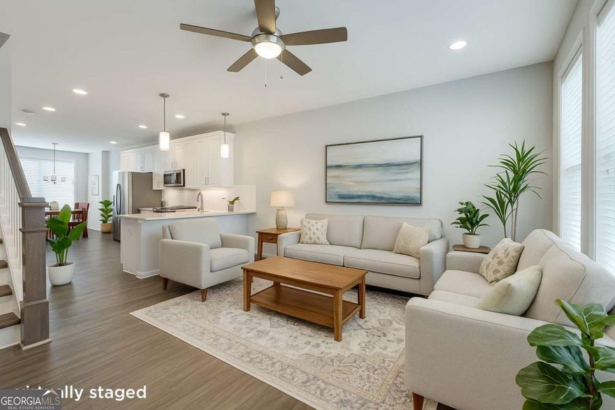 This stunning 3 bed/3.5 bath townhome features high-end finishes, an open floor plan, and spacious living areas perfect for entertaining. Each bedroom has its own private bath, plus there's a 2-car garage, ample storage, and a relaxing covered porch. Minutes from the Beltline, Grant Park, dining, and the airport. Perfect for young professionals, family, or investor (with no rental cap)! Assumable loan at just 2.63% for qualified buyers-don't miss this rare opportunity!