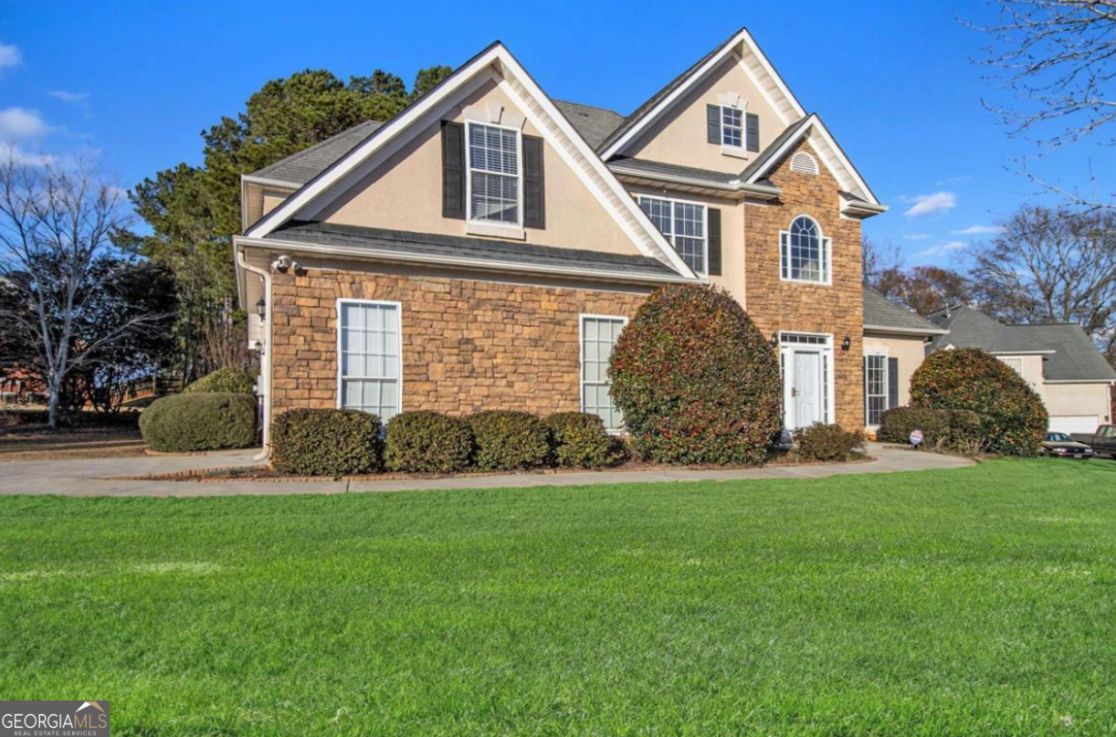 Welcome to 113 Glenmore Lane! This beautiful 5-bedroom, 3-bath single family home offers 2,420 sq. ft. of comfortable living space in the highly desired Highlands at Eagles Landing community of McDonough, GA. Move-in ready and thoughtfully maintained, this home blends charm, functionality, and space for the whole family. Step inside to find a warm and inviting layout, perfect for both everyday living and entertaining Home boasts LVP flooring, upscale light fixtures, modern hardware, quartz countertops, and stainless steel appliances. The spacious family room flows seamlessly into the kitchen and dining areas, creating a cozy setting for gatherings. With five bedrooms including a generous owner's suite, there's plenty of room for everyone to unwind. Outside, you'll enjoy a large private yard, ideal for family fun, gardening, or relaxing evenings under the Georgia sky. Nestled in a sought-after subdivision, this home combines the comfort of suburban living with easy access to shopping, dining, schools, and major highways. Don't miss the opportunity to make this charming family home in Highlands at Eagles Landing your own!