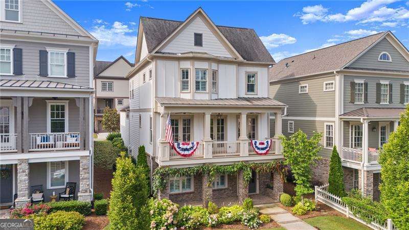 ***Limited Time Offer: Enjoy a First-Year Mortgage Rate of Just 3.99%! Take advantage, don't miss this special offer with first year mortgage rate of 3.99, 2nd year 4.99 locked at 5.99 after** Do you want to live a lifestyle that has been thoughtfully designed to combine luxury with all the amenities and entertainment at your fingertips. This vibrant neighborhood feels like its own little town with with beautiful streets * sidewalks, walking trails, clubhouse, gym, pool, outdoor amphitheater, firepits (they even provide the firewood) walk to shops within the community or 1/2 mile walk (Golf Carts permitted) to downtown Woodstock restaurants, breweries and entertainment. Whether you're looking to stay social with community clubs and planned events or simply soak in the energy of this lively setting, you'll love the balance of activity and comfort. One of the few detached homes available, this rare property features a three-car garage with main-level entry-an uncommon find in this community. Inside, you'll discover standout upgrades like a new high-capacity HVAC system (2022), whole-house surge protection, and built-in surround sound with custom lighting throughout. The gourmet kitchen impresses with ceiling-height cabinetry, a custom vent hood, walk-in pantry, and a dedicated coffee bar. There's also a home office on the main level, perfect for today's lifestyle. *Designed with impeccable detail and premium finishes, this is more than just a home-it's your gateway to the best of Downtown Woodstock living