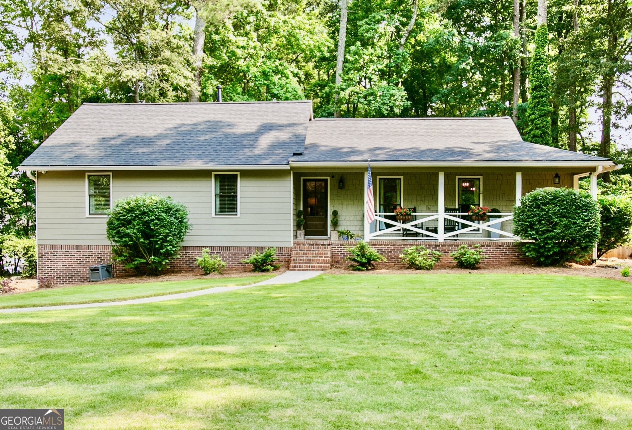 In the Heart of West Cobb, this Ranch on a Basement has all the Updates! Open Concept Floor Plan with 4 Bedrooms, 2 Baths & LVP Flooring throughout Main Level. The Covered Rocking Chair Front Porch welcomes you. This Home has had Walls Opened Up, Paneling Removed & Ceilings Smoothed to Created a Vibrant and Modern Living Space. The Completely Remodeled Kitchen features Wellborn Cabinets with Spice/Utensil Drawers, Level 6 Quartz Counters and an Upgraded Picket Backsplash. New LG Stainless Appliances, Under Cabinet Lighting and an Oversized Center Island with Hidden Outlets complete this Perfect Entertaining Space. Walk-in Butler's Pantry designed by Artisan Closets with Cabinets & Dedicated Line for Appliances. Spacious Family Room with Vaulted Ceiling and Fireplace. Primary Suite has an Expanded Closet with Customized Shelving from Artisan Custom Closets. Master Bath boasts Several Upgrades including Wellborn Cabinets with Hidden Electrical Outlets, Double Vanity with Level 6 Quartz Counters and a Tile to Ceiling Shower with Two Large Niches and a Foot Niche. All Secondary Bedrooms have Walk-in Closets. Finished Basement has a 4th Bedroom and a Generous Closet. This Extended Room could also be another Family Room, Office or Fitness Area. Redesigned Laundry Room with Deep Mud Sink, Cabinets and Hanging Racks. Washer/Dryer Remain. HUGE Fenced Backyard for Kids and Pets. 2023 Landscaping including Zeon Zoysia, Bushes, Bulbs and Grasses. 2024 Beautiful Screen Porch and Large Grilling Deck. 2024 HVAC System. 2020 Roof with 2023 Duct Cleaning. 2022 Improvements include All New Windows, Interior/Exterior Paint & New Exterior Doors. 2024 New Oversized Garage Doors Installed. Lake Somerset is Lovely Community with Swim/Tennis and a Private Lake. Hillgrove High School. Perfect End of the Street Location with Extra Parking. This is TRULY a Must See!
