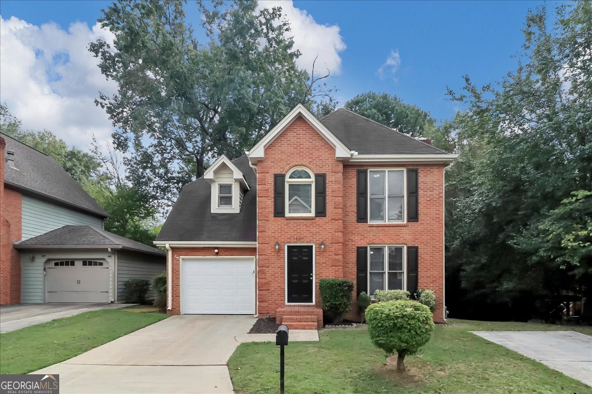 Welcome to this stunning 1,830 sqft, two-story residence located in the desirable community of Camden Walk, offering 3 beds and 2 full baths. Blending timeless appeal with modern living, the inviting brick facade, accented with elegant white trim, creates exceptional curb appeal. The exterior is punctuated by double-hung windows and an arched window above the stylish black front door, while the two-car garage adds both practicality and sophistication. Surrounded by lush landscaping and mature trees, this home offers a tranquil suburban retreat.    Step into the light-filled living room, where classic design meets contemporary comfort. The crisp white walls create a bright and fresh atmosphere, while the textured ceiling adds a touch of character. At the heart of the room, a stone fireplace with a sleek black interior invites evenings by the fire. Natural light streams in through the window, offering serene outdoor views, while soft grey carpeting completes the welcoming ambiance. This serene space is perfect for relaxing or entertaining guests.    The well-appointed kitchen combines both style and functionality. Rich white cabinets offer generous storage, while speckled countertops provide ample workspace. Sleek appliances-including a refrigerator and stove-add a modern touch. Whether preparing gourmet meals or enjoying your morning coffee, this kitchen is designed for both convenience and enjoyment.    Adjacent to the kitchen, the inviting dining area is perfect for creating lasting memories over meals. Natural light streams through the window, and a door lead to an outdoor oasis, making this the ideal spot to enjoy breakfast or unwind after a long day.    The tranquil primary bedroom is designed for ultimate relaxation. Light gray carpeting offers comfort, while the white walls create a soothing environment. A ceiling fan with lights ensures year-round comfort, and the window, adorned with blinds, provides privacy and peaceful views. The en-suite bathroom is a private retreat, while the two closets offer ample storage space for all your needs.    The additional bedrooms are spacious, each featuring their own closet, ensuring comfort and privacy for family members or guests.    Located in the peaceful Camden Walk community, this home is a standout with its thoughtful design, modern features, and attention to detail. With convenient access to local amenities, shopping, and dining, it provides the perfect blend of suburban living and modern convenience. Schedule your private showing today and make this exceptional home your own!