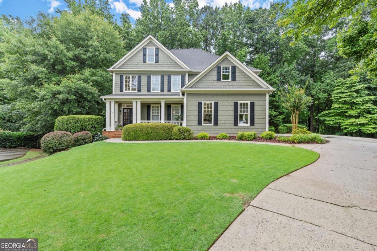 ASK ABOUT OUR BUYER INCENTIVE! Discover this gem tucked away on a private cul-de-sac lot in one of the most sought-after communities in Crabapple- rarely see anything for sale in Danbury Park! This beautifully maintained 5-bedroom, 5-bath home is just a sidewalk stroll to top-ranked Fulton County schools and Downtown Milton's vibrant new entertainment district. Step inside to find a freshly updated interior, including a fully renovated kitchen with quartz countertops, custom tile, upgraded cabinetry, and oversized island with counter seating. Refinished hardwood floors, new carpet, and fresh paint inside and out! A spacious main level featuring a guest bedroom, open concept formal dining, living and keeping rooms, and a large tiled laundry/mudroom. Upstairs, a thoughtful layout includes a private primary suite with a beautifully renovated spa bath and walk in closet, three secondary bedrooms- 2 with jack-and-jill bath, and a bedroom with ensuite bath. The fully finished terrace level is a standout, offering flexible living and entertainment space. An office (or 6th bedroom), full bath, rec room with wet bar, home theater with wired 5.4.1 surround sound + projector, and home gym. Enjoy peaceful and private wooded views from your back deck or walk-out patio- the perfect spot for morning coffee or sunset gatherings. Active swim/tennis/pickleball community and walkable lifestyle with all that Downtown Milton Crabapple offers just 0.5 miles away, top rated Fulton Co schools just 0.8 miles away and 3 miles from Downtown Alpharetta. A must see!