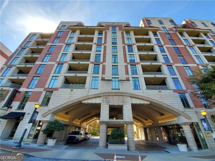 Welcome to this exquisite 2-bedroom, 2-bathroom penthouse located on the 9th floor, offering a perfect blend of modern luxury and convenience. The open-concept design features a spacious and airy floor plan with a large, modern kitchen complete with granite countertops, sleek stainless steel appliances, and a layout that seamlessly flows into the expansive living room and dining area. Floor-to-ceiling windows flood the space with natural light while offering a postcard-perfect view of the iconic Mercedes Benz Stadium. The ideal split layout places the two bedrooms at opposite ends of the home, ensuring maximum privacy. The primary suite is a true retreat, boasting direct access to the private terrace, a generous walk-in closet, and a spa-inspired bath with marble countertops, double vanities, and a luxurious soaking tub. The secondary bedroom is equally impressive, with a well-appointed hall bath featuring a travertine walk-in shower and more stunning marble countertops. This full-service building offers exceptional amenities including 24-hour concierge service, a sparkling pool, a gym, and a rooftop terrace with outdoor grills and breathtaking views of Centennial Park and the Atlanta skyline. You'll also have the convenience of two gated parking spaces, ensuring you always have a secure spot. Located just steps away from some of the best dining and entertainment options in the city, this penthouse is the epitome of urban living. Don't miss your chance to call this luxurious space home-schedule a tour today!