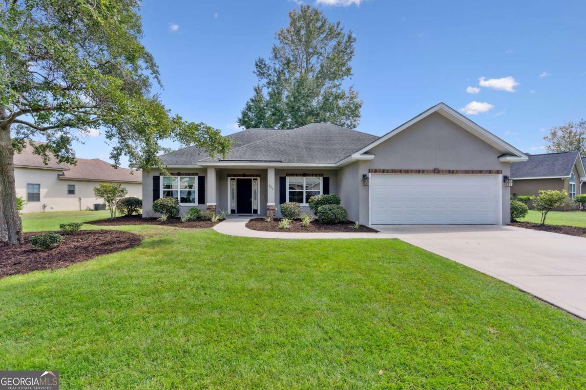 Like New! Beautiful 4 bedroom home, LAGOON frontage, with nice appointments! Features include Shaker Style Cabinets in Kitchen, Hardwood Floors in Main living area, Tile in Bathrooms, Carpet in Bedrooms. Kitchen offers Granite Counter Tops, Stainless Appliances. Bathrooms feature Marble Counter Tops. Located in the desirable Lexington Place Subdivision, residents enjoy access to a swimming pool, tennis court, and boat/RV storage. Conveniently situated near the North Glynn Recreation Complex, offering walking trails, basketball and tennis courts, a skateboard area, dog park, multiple fields for baseball, softball, football, and soccer, as well as playgrounds and more! UTILITIES: GA Power, Public Water & Sewer. Internet: Live Oak or Xfinity. Termite Bond: Yates Astro. HVAC 7 yrs & new capacitor install July 2025. Roof 7 yrs old. Easy to show!