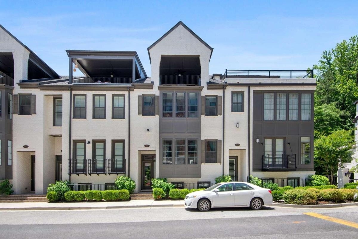Welcome to this immaculate luxury town-home in prime Chastain Park. Massive main level features 2 living areas, 2 dining areas, and rear porch overlooking firepit/green-space. Elevator included!!! Open Kitchen with huge island features Cambria tops, chef grade stainless steel appliances, upgraded cabinetry, custom installed 77 bottle wine refrigerator. Private master suite is spacious and luxurious with an oversized bathroom, walk-in closet, and laundry room. Perfectly co-located to secondary bedroom.The top level is a show stopper with full bed/bath, custom wet bar and covered rooftop deck. Custom wet bar features: shelving display, bar ice maker, wine fridge (46 bottles), fridge/freezer combo drawer, dishwasher, stone top, sink, and custom cabinetry. Secondary bedrooms on 3 levels have private en-suite baths. Upgraded wide plank wood flooring throughout. Custom paint job. Tons of natural light. Private and secure gated community. 2 car garage. This is a special unit, and a wonderful luxury home.