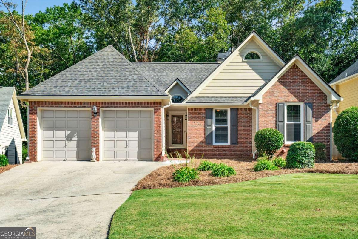 Welcome to true one-level living in the heart of West Cobb! This beautifully updated ranch home combines comfort, accessibility, and style. Perfect for those looking to simplify life without sacrificing quality. Step inside to an open floor plan with vaulted ceilings, a cozy fireplace, and an oversized sunroom that floods the home with natural light. The split-bedroom layout ensures privacy, while the updated kitchen with granite countertops, tile backsplash, and a sunny bay-window breakfast nook is ideal for everyday living. The owners' suite features a spacious custom-tile walk-in shower with frameless glass, a double vanity, and generous closet space. Both bathrooms have been tastefully remodeled with modern finishes, offering peace of mind and convenience. Accessibility has been thoughtfully added with easy front entry, plus a ramp off the back deck for seamless access. Outside, the professionally landscaped backyard is perfect for enjoying the seasons, and the newly constructed shed with a large concrete pad adds storage or hobby space. Additional upgrades include a newer roof, windows, flooring, plumbing, water heater, HVAC, lighting, and fresh paint throughout-this home is truly move-in ready. Best of all, the neighborhood has no rental restrictions, giving you the peace of mind of an established community of homeowners. Located less than 5 minutes from The Avenue West Cobb, shopping, dining, and healthcare are always close at hand. This is the perfect home for anyone seeking comfort, convenience, and long-term enjoyment in a desirable Marietta location.