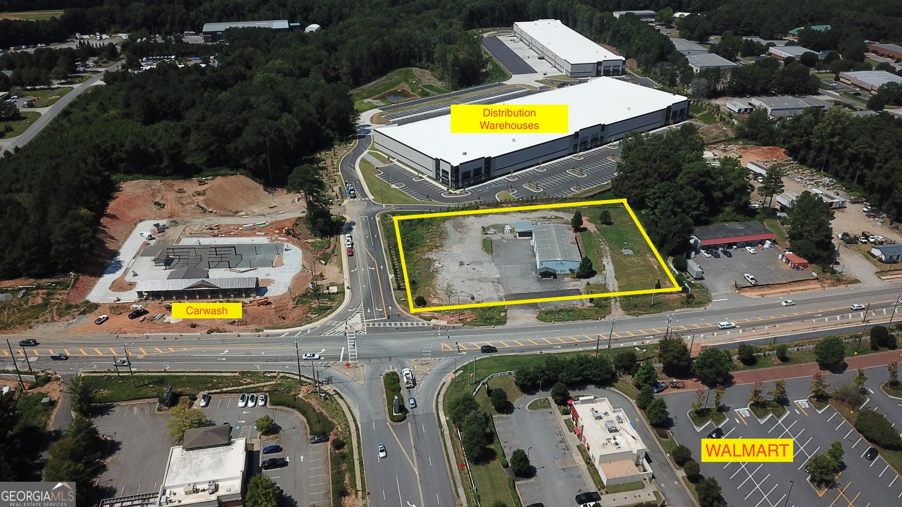 Assemblage at the corner of Atlanta Highway and Logistics Drive Public Water and Sewer on site Ingress and Egress on both Atlanta Highway and Logistics Drive 5000 sf industrial/commercial building with 3 x high top rollup doors level topography, should be near self contained for pad ready