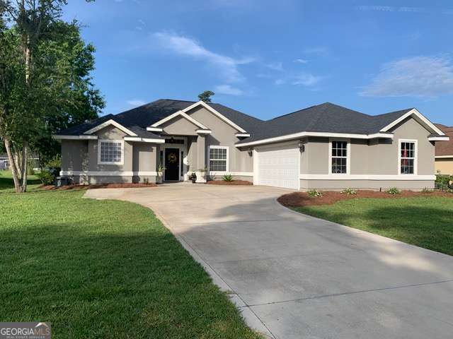 This stunning house located in Laurel Island Plantation has four bedrooms, three full bathrooms, and spreads over an area of 2072 square feet. The property boasts a split floor plan that includes an oversized master bedroom with a spacious ensuite bathroom. The bathroom features a large natural stone walk-in shower, an oversized soaking tub, water closet, dual vanities, and dual walk-in closets. The house's open floor plan includes the foyer, formal dining room, living room, kitchen, and kitchen dining area, making it light, bright, and perfect for entertaining. The kitchen features a walk-in pantry, granite countertops, stainless steel appliances, an over-the-range microwave, and a wrap-around breakfast bar. You will also enjoy the view of the neighborhood lagoon and fountains from the master suite, living room, kitchen, and one of the bedrooms. In addition, the house comes with an oversized two-car garage with a floored-in attic above. You will have access to the community pool, tennis courts, and playground. The owner may consider dogs, but it is subject to approval and additional fees. All Kings Bay Rentals LLC residents are enrolled in the Resident Benefits Package (RBP) for $39.95/month, which includes renters insurance, credit building to help boost your credit score with timely rent payments, $1M identity protection, HVAC air filter delivery (for applicable properties), move-in concierge service making utility connection and home service setup a breeze during your move-in, our best-in-class resident rewards program, and much more! More details upon application.