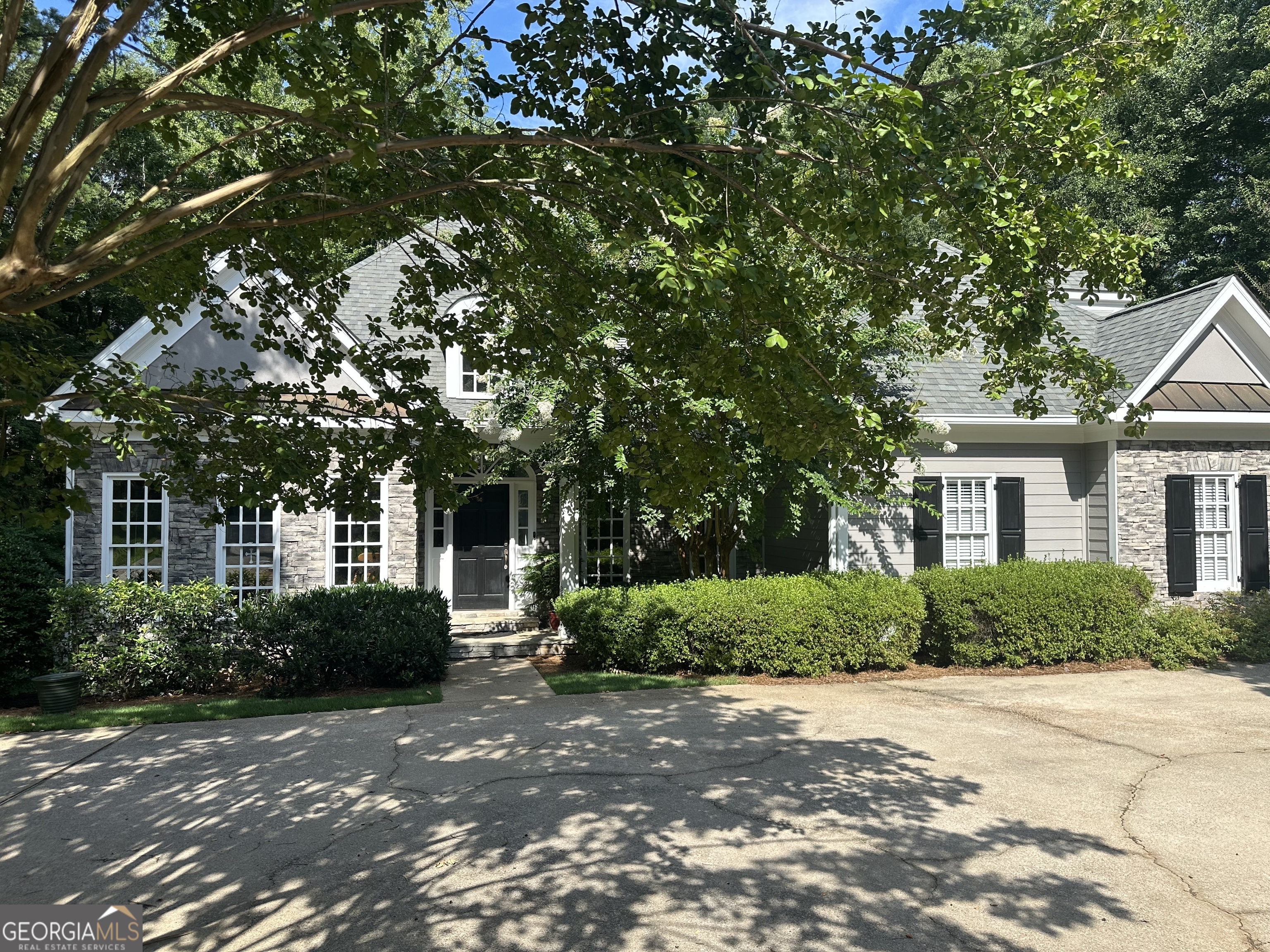Located in Moss Creek Neighborhood with lake access and community dock. This lovely custom built home is perfect for all life stages. A large primary suite and bathroom with separate tub & walk in shower is located on the main floor as well as an additional bedroom and bathroom. Beautiful moldings and stone fireplace makes this living areas warm and welcoming. The laundry is also located adjacent to the kitchen with lots of storage and extra pantry. Upstairs provides a Jack & Jill bedroom design with shared bathroom plus an extra space for playroom, office, or bonus room. A full basement offers a 2nd kitchen with entertaining in mind, opening to the outside patio. Tons of room for whatever life brings you, teenagers, in law suite or just fun with friends and family. Storage area is heated and cooled. Lovely lawn with sprinkler system and circular driveway! Don't miss this opportunity to come see this amazing home!