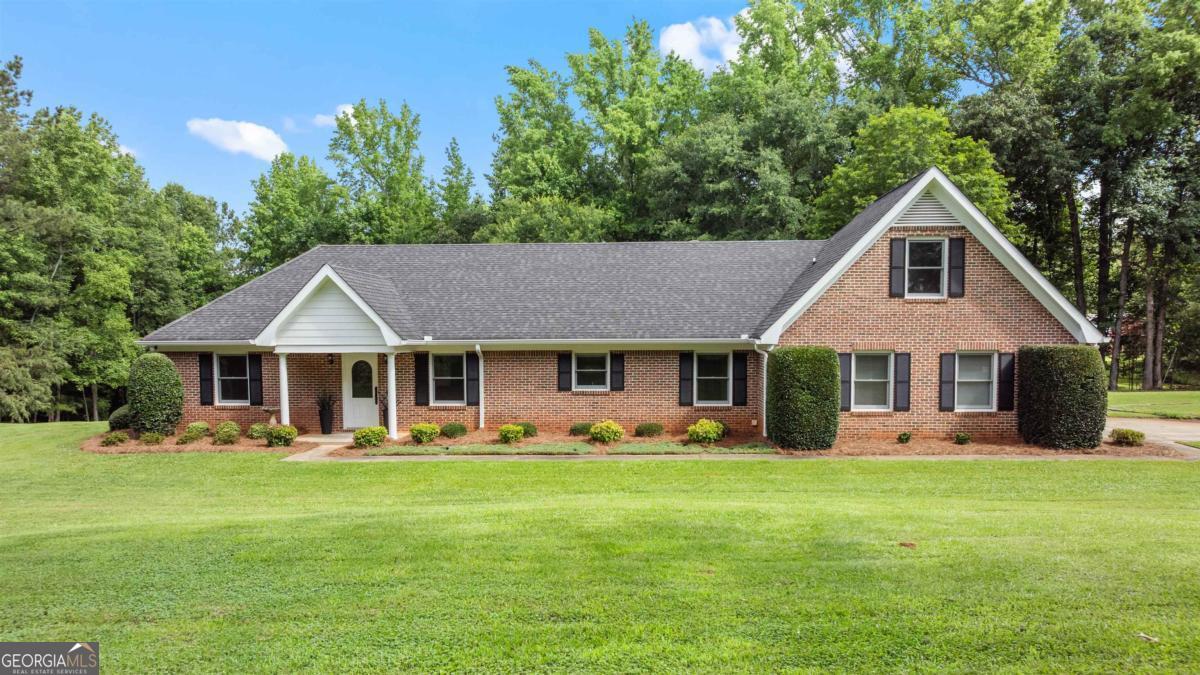 STOP!! You need to see this! 4 Sided brick ranch with 4 bedrooms .. 3 full baths and 2 half baths .. raised brick fireplace and amazing sunroom PLUS completely separate 2 bedroom 1 bath cottage with kitchen and living room with its own fireplace. Cottage built in 2002. All located on 13.85 acres of manicured, privacy. Did I mention the pond with its own dock? And all of this located in Madison, Georgia, which was ranked one of the most beautiful small towns in America! About 30 minutes to the Sugar Creek Marina on Lake Oconee to put your boat in and go fishing..10 Miles to Morgan County High School .. 8 Miles to La Patisserie on Main for desserts and fresh bread (both made on site!) 6 miles to the Georgia Safari Park and the I-20 on ramp. You're also about 30 miles to UGA football games! Price, Location, Size and Condition ~ yes, yes, yes, yes!