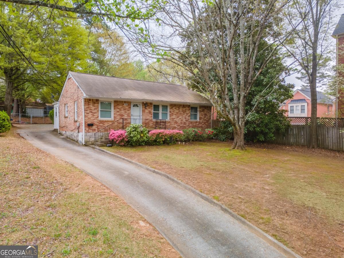 Nearly 100K in Upgrades and Improvements since Purchased; New Roof, Windows, HVAC, Hot Water Heater, Updated Bathrooms and Kitchen, Hardwood Flooring Throughout! Walking Distance to Downtown Decatur and Everything it has to Offer. Large Parking Pad in Rear of Home can Accommodate many Cars, Trailers, Boats, etc. Zoned OI but can Zoned Residential...Perfect Work from Home Property for a Small Business, Has been a Great Rental in the Past. 2 Bedrooms with Extra Bonus Room / 1 Full Bathroom with an Eat-In Kitchen and Separate Dining Room. Large and Open Family Room with a Separate Laundry Room with Private Entrance to Parking in Rear. Fenced Backyard and Cement Patio Featured in Back of Home. Full Brick Exterior on a Level Lot!