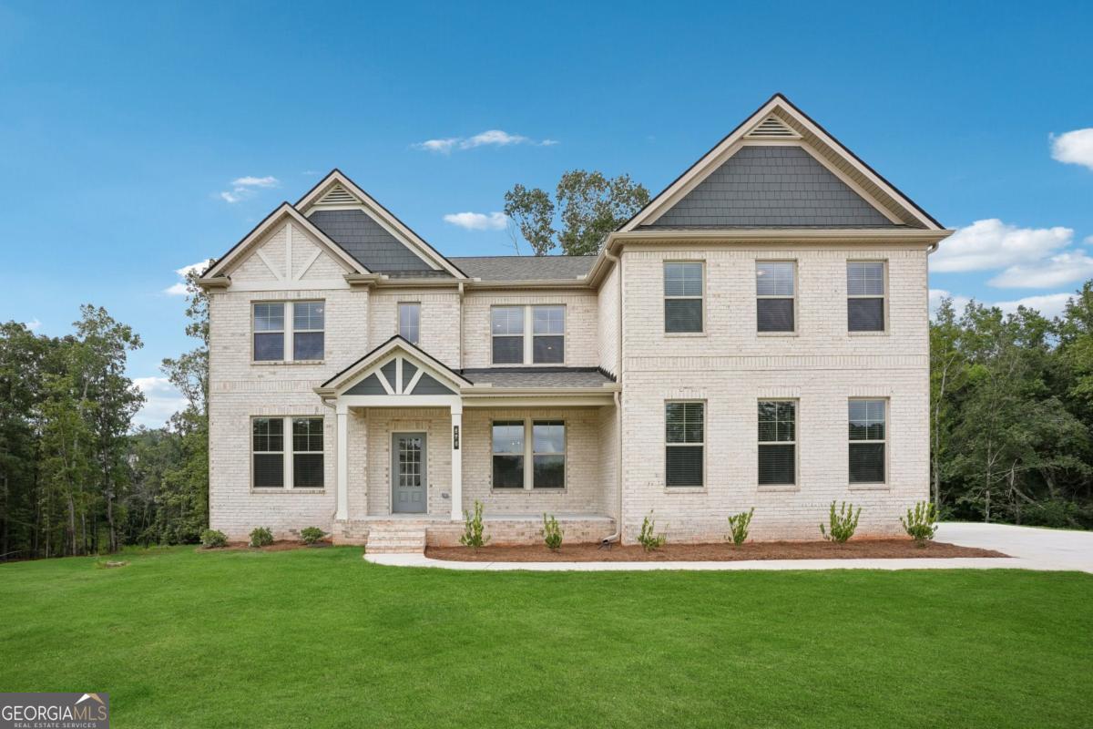 Why wait for New Construction when you can step into your MOVE-IN READY DREAM HOME TODAY? This BRAND NEW, NEVER-LIVED-IN 5-Bedroom, 4-Bathroom home is the Clarity floorplan and is located in the highly sought after Trinity Park subdivision in Mcdonough GA. This home has been carefully and thoughtfully designed by the builder DRB Homes, with premium upgrades, designer touches, and every convenience already in place-making it truly BETTER THAN NEW. From the moment you arrive, the home's light-colored 4-sided brick exterior, side-entry car garage, and OVERSIZED driveway that fits nearly 10 cars create a striking first impression. Perfectly situated on a PREMIUM CUL-DE-SAC Lot, the property offers unmatched privacy, scenic views, and one of the best locations in the community. Step inside to a 2-story foyer, with a formal dining room to the right and a formal living room to the left (which can be converted into a home office). The heart of the home is the open concept Family Room and gourmet kitchen, featuring a brand new refrigerator, double oven, all stainless-steel GE appliances, white cabinetry, and sleek white countertops for a bright, modern look. The open floor plan flows effortlessly into the spacious Family Room with its elegant coffered ceiling, creating the perfect space for everyday living and entertaining. This spacious home includes 5 bedrooms and 4 full bathrooms, with a bedroom and full bath conveniently located on the main level complete with an upgraded standing shower. Upstairs, the large primary suite feels like a private retreat, offering a sitting area, spa-inspired bathroom with an oversized walk-in shower, and an expansive walk-in closet. The laundry room is also upstairs for added convenience and is ready to go with a brand new washer and dryer included, along with an additional loft area thoughtfully designed by the builder-perfect as a second living space, media room, or playroom. The home also boasts a very spacious unfinished basement, stubbed and ready to be customized to fit your vision-whether a home theater, gym, or additional living quarters. Blinds are installed throughout the house for immediate comfort and ease for your Family. Outdoors, enjoy an upgraded extended patio about 12' x 30' in size along with a beautifully crafted and sturdy back deck, perfect for relaxing or entertaining with Family and Friends while overlooking one of the best and private views in the neighborhood. This home can be enhanced even further in the future by adding a screened in sitting area underneath the deck as well as possibly extending the backyard by taking down the trees for absolutely stunning scenic view. This is your chance to own a truly turnkey luxury home-beautifully designed, completely move-in ready, and available now without the wait of new construction. Schedule your private tour today and experience the perfect blend of elegance, privacy, and convenience! *This is a Brand New Home, so please use GPS Address - 1760 Conyers Rd McDonough, GA*