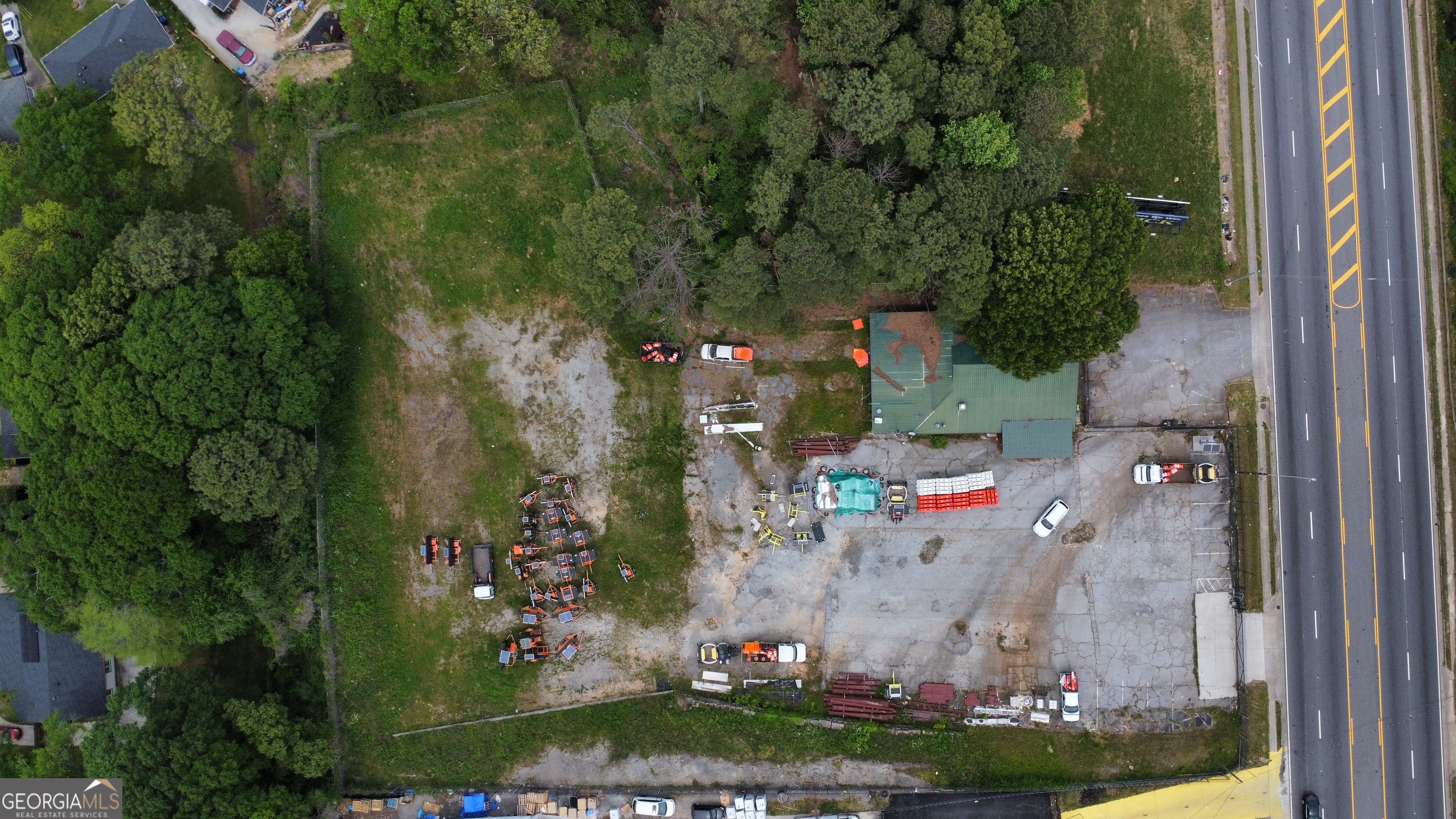 Prime Opportunity in Atlanta: Explore this exceptional 2.2-acre lot, featuring two buildings-a 2985 sq ft bar and a 2500 sq ft prefabricated building-offering limitless potential for development. Located just one mile from the Atlanta Belt-Line, this property enjoys unparalleled proximity to Atlanta's bustling neighborhoods. With two commercial lots totaling over 14,000 sq ft and easy access to major interstates-including I-20, I-285, and I-675, all within three miles-it presents an excellent opportunity for various commercial ventures, from restaurants and bars to retail outlets or offices. Boasting a rich history as a popular bar and restaurant since 1954, this property stands as one of the last available commercial lots in Atlanta. Nearby renovated apartments guarantee a steady flow of foot traffic, augmenting the visibility and accessibility of businesses in the area. Whether you're an experienced investor or a budding entrepreneur, don't miss the chance to become a part of Atlanta's vibrant landscape. Schedule a viewing today and uncover the boundless opportunities awaiting at this prime Atlanta property.