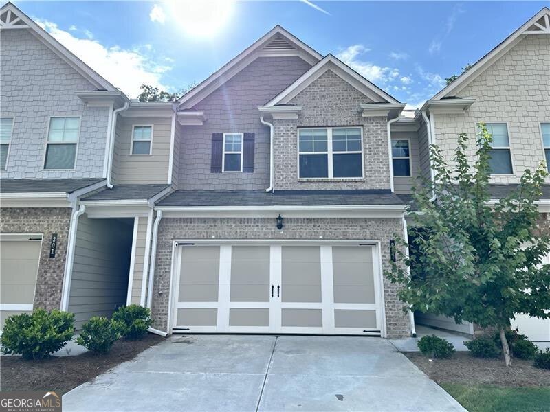 This SUPER AWESOME WELL MAINTAINED, Two Year Old, Looks Brand New, Ready to move in, located in the most sought after Park at Camden community. This 3 bed 2.5 bath Town home features an open-floor plan concept, with an open dining room, family room and Enjoy your contemporary kitchen complete with stainless steel appliances, granite counter tops, and fashionable hardwood floors throughout the first floor. Upstairs features Huge master bedroom boasts private wooded views and a luxurious primary bathroom featuring dual vanities, separate tub/shower, and walk in closet! Secondary bedrooms are spacious and bright with a Jack & Jill bathroom. Laundry room conveniently located upstairs. This house also comes with a private backyard with patio fully usable making this home perfect for indoor/outdoor entertaining! Park at Camden is conveniently surrounded by plenty of shopping, dining, and entertainment, the Outlet Shoppes, Shops at Trikum, The Centre at Woodstock, and several area golf clubs. This subdivision also allows easy access to dog parks and Dupree Park, an area featuring basketball and tennis courts, fitness stations, and nature trails: a place perfect for hiking and biking. This townhome is a must see! Ready for a quick and easy closing!