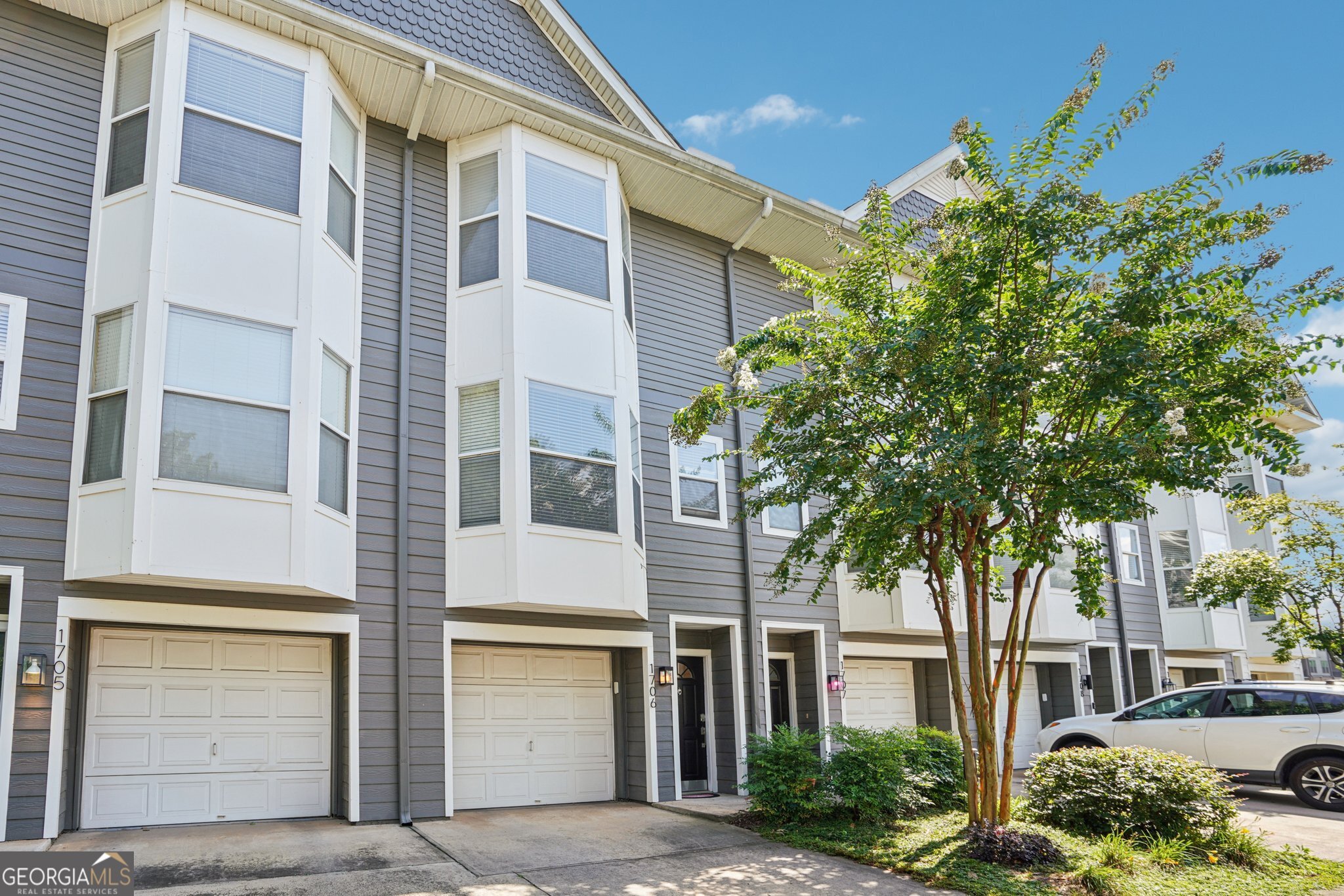 Welcome to 951 Glenwood Ave SE #1706 - a beautifully maintained 3-bedroom, 3.5-bathroom townhome in the heart of Atlanta's vibrant neighborhood, just minutes from the BeltLine and East Atlanta Village. Inside, you'll find an open-concept living and dining area, ideal for entertaining. The updated kitchen features sleek cabinetry, stunning countertops, and modern finishes that blend style with functionality. Upstairs, the spacious primary suite features an ensuite bath with a separate soaking tub and shower, along with a generous walk-in closet. A second upstairs bedroom also enjoys the privacy of its own ensuite bath. The terrace level offers an additional bedroom and full bathroom-perfect for guests, a home office, or flex space. Step outside to a private, fenced backyard and patio-great for pets, grilling, or relaxing. Additional highlights include a 1-car garage, city views from the front of the home, and fantastic on-site community amenities. With grocery stores nearby and access to restaurants, shops, and parks just steps away, this home offers the perfect blend of convenience, comfort, and city living. Don't miss your chance to own this incredible home in one of Atlanta's most desirable neighborhoods!