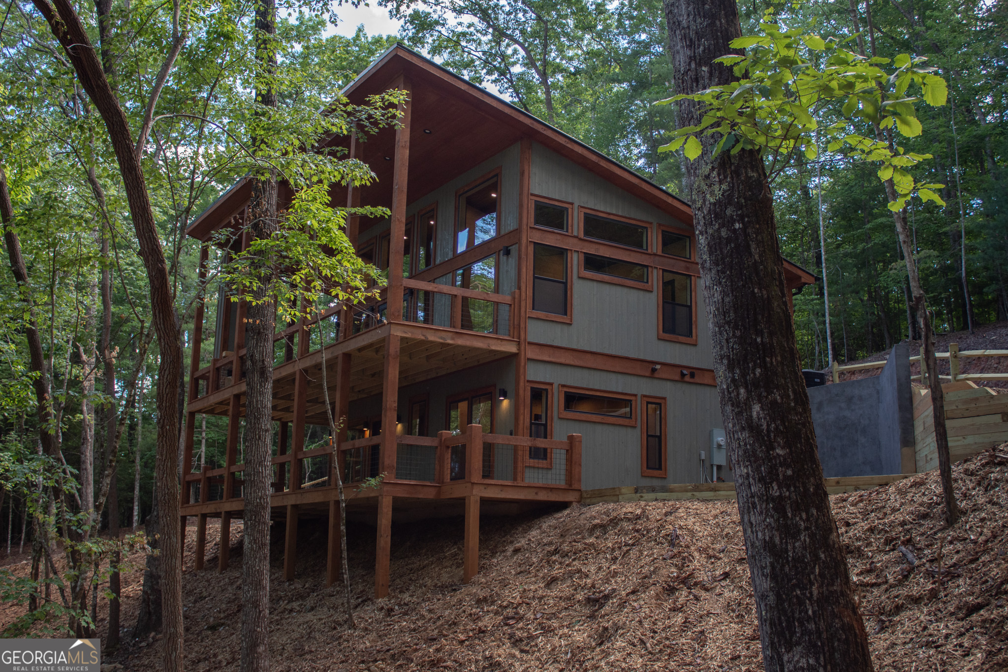 PRE CONSTRUCTION... This New Modern Cabin will have 3 bedrooms, 2 full bathrooms, 3 fireplaces(2 inside, 1 outside), 2 living rooms, wet bar, dining area, 2 large porches, and so much more. Builder provides an allowance package for buyer to pick out all appliances, colors, tiles, flooring, and cabinets. This beautiful lot features mountain views and borders 190 feet of Nation Forest. Come and enjoy this beautiful mountain modern cabin near the Aska Adventure Area. Near Toccoa River and hiking and biking trails, kayaking, tubing and more!