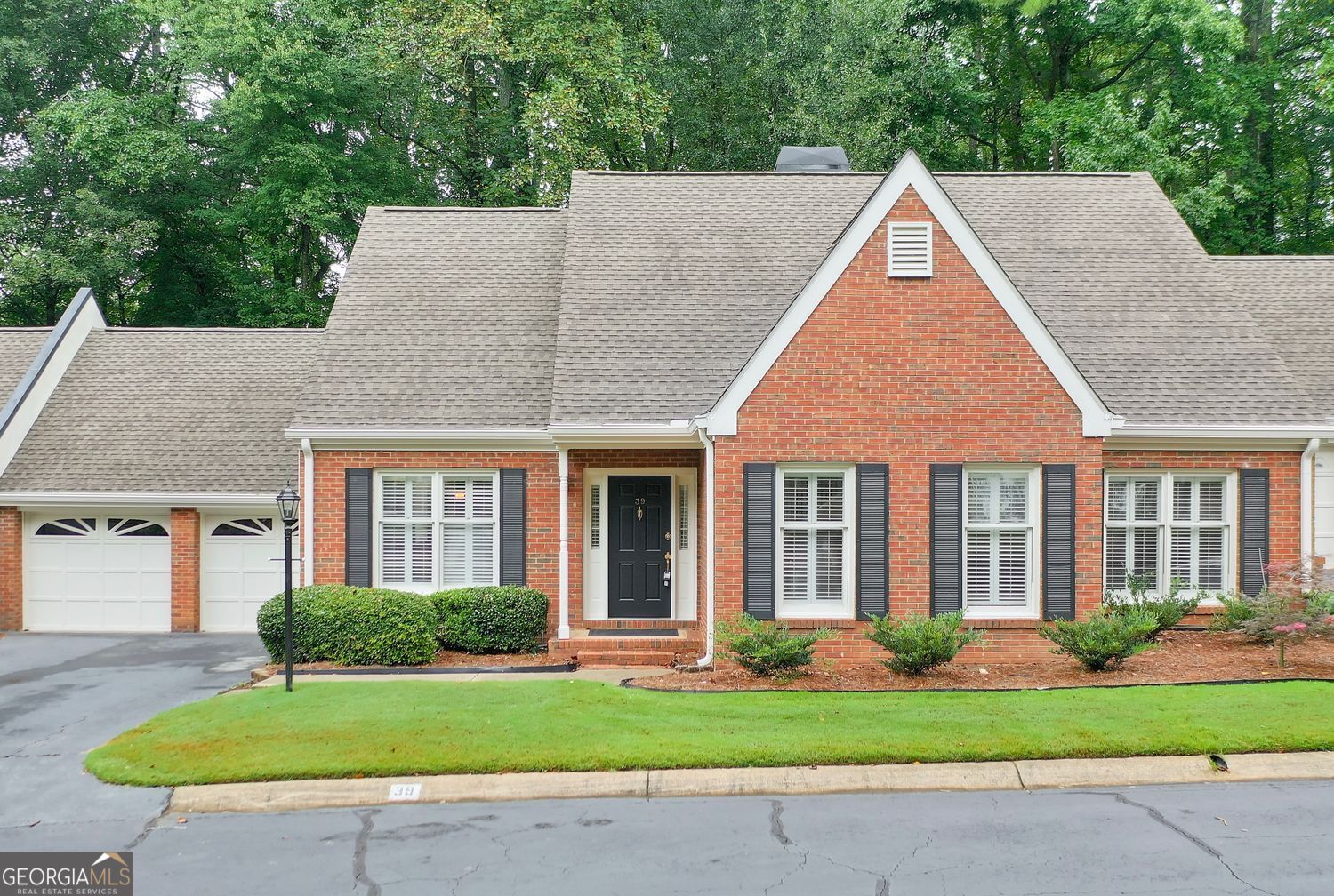 Maintenance-free lifestyle meets unparalleled convenience in this lushly landscaped community at the crossroads of Sandy Springs and Dunwoody. Renovated, open, and light, with separate living and dining rooms, master and secondary bedrooms on main level, and a great room opening to private back garden and protected greenspace. The chef's kitchen includes stainless steel appliances, a convenient spacious pantry, and abundant counter space. The breakfast room has a bay window and a view of the greenspace. Upstairs, there's an oversized bonus room with full, new bath to use as a guest suite, office space, or workout room. Enjoy ultimate accessibility with proximity to UPS and Mercedes-Benz, Dunwoody Village, Perimeter Center, the iconic King and Queen Buildings at Concourse, Dunwoody Nature Center, Spruill Center for the Arts, and effortless access to I-285 and GA400.