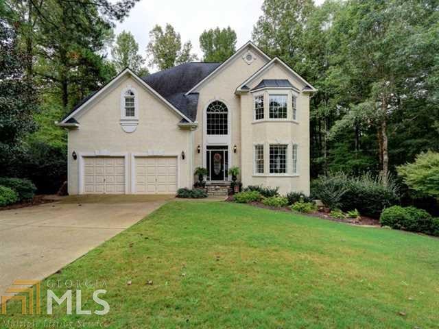 Paradise in Eagle Watch! Inside is even better than the photos! Hardwoods throughout main level, plus stairs, landing, master! Formal living and dining, updated kitchen, breakfast room and family room with fireplace. Incredible covered deck with ANOTHER fireplace. Upstairs boasts 4 bedrooms, 3 full baths. Updated master spa, beautiful master sitting area. Terrace level perfect for rec room, office, media room plus tons of storage. Outdoor living is divine! Golf course, level, private lot with ample room to play or entertain. Perfect for anyone, this can be your own dream home.