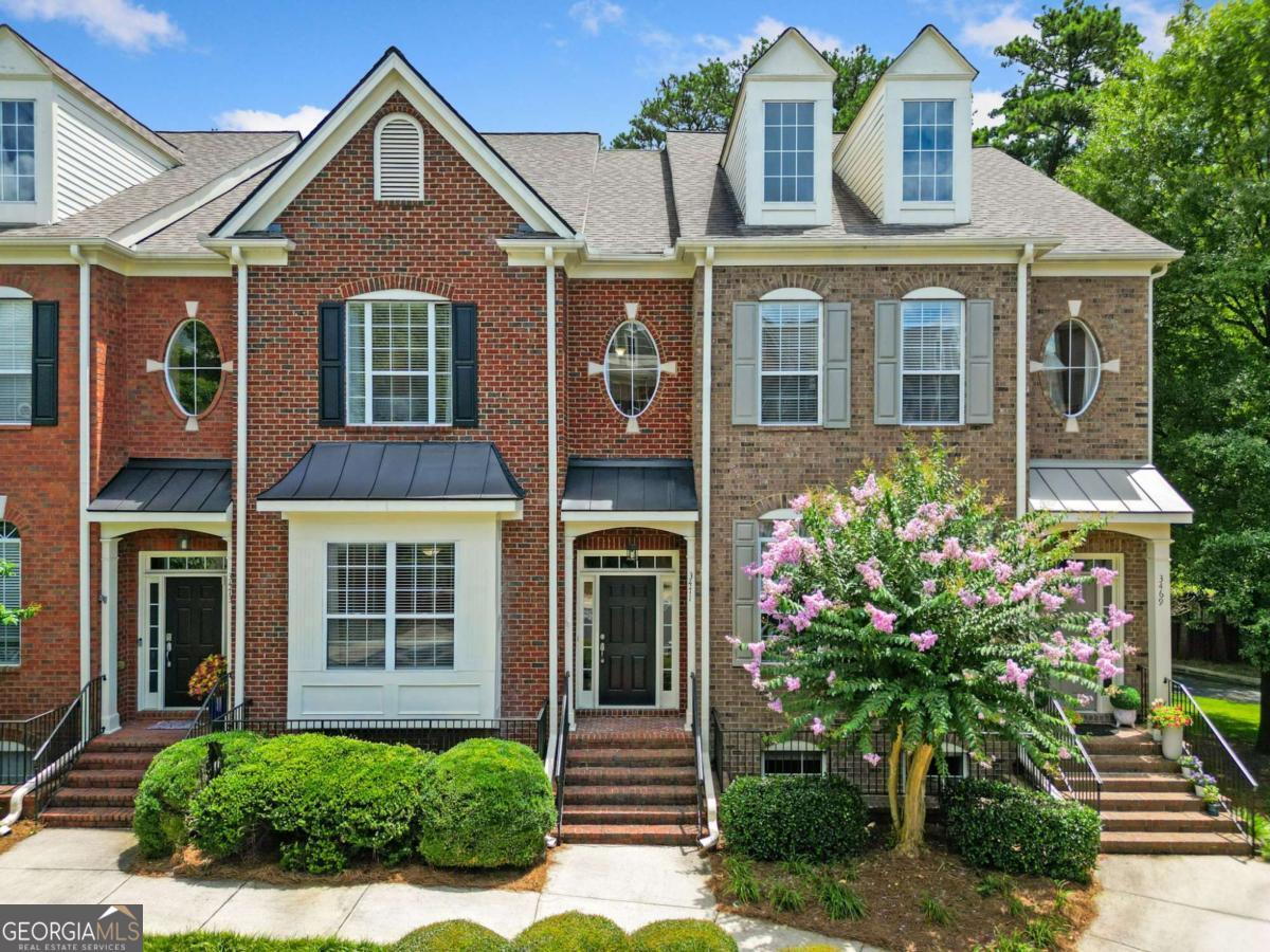 Don't miss this unique opportunity to own a beautifully maintained, spacious townhome in one of the area's most desirable gated communities. Featuring 3 generously sized bedrooms, 2 full bathrooms, and 2 half bathrooms, this rarely available floorplan offers the perfect blend of comfort, function, and style. Inside, you'll find gleaming hardwood floors throughout, an open, light-filled layout, and abundant storage throughout the home from California Closets. The large two-car garage adds even more room for vehicles, storage, or a workshop. Your thoughtfully designed living spaces make this home ideal for both everyday living and entertaining. The back deck with retractable awning offers indoor/outdoor living and year-round enjoyment. Nestled in a quiet, secure entry neighborhood, this townhome is also convenient to shopping, and just a short drive to Brookhaven, Henderson Park, and Downtown Tucker-offering easy access to outdoor recreation, restaurants, and local events. Opportunities to own this floorplan are rare, so schedule your private showing today and experience all this beautiful home has to offer!