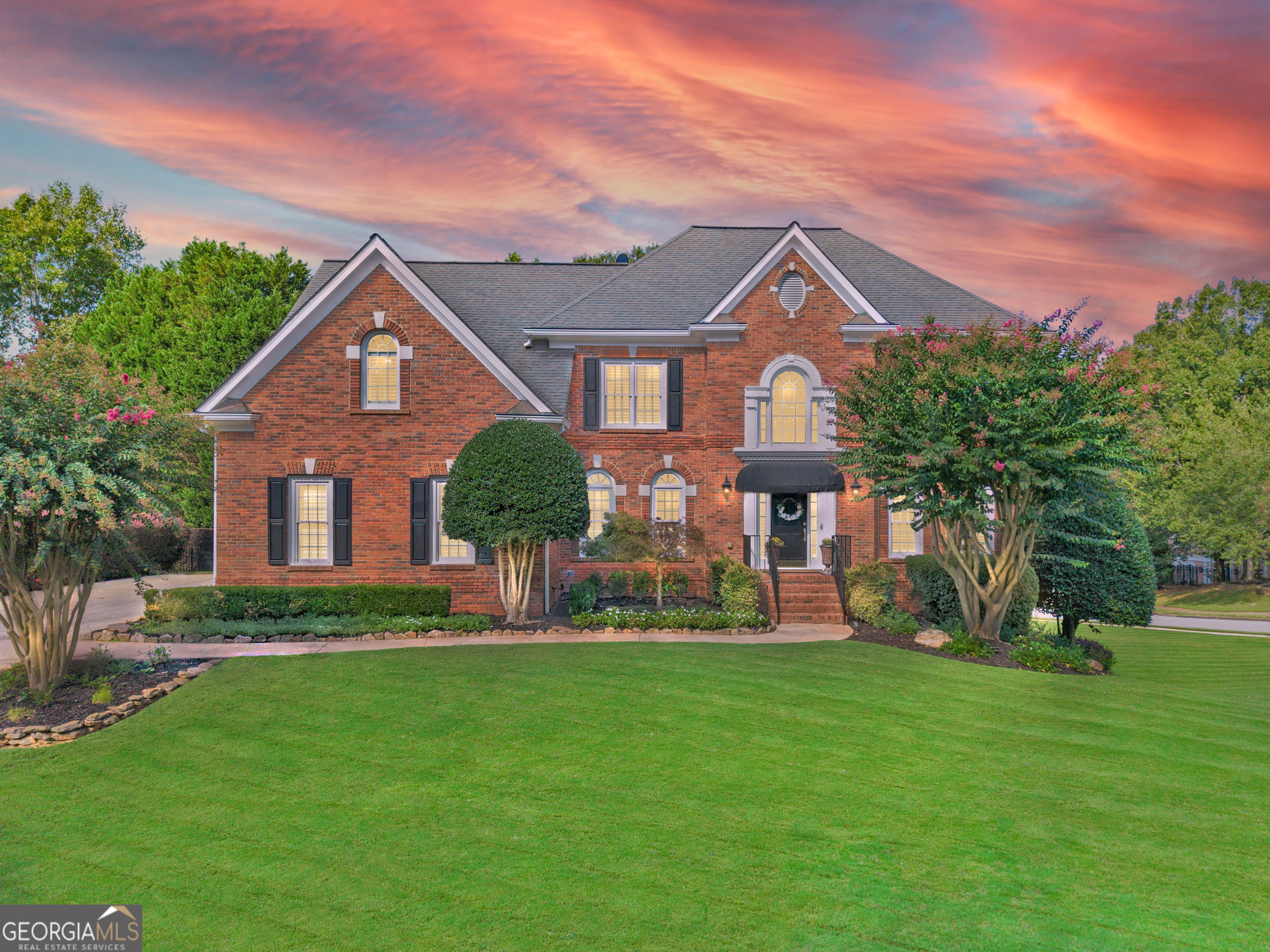 Wow! This is the one you've been waiting for! Welcome Home to this completely renovated 5 bed, 5 bath, 3-car garage home in the highly sought-after Alpharetta/Johns Creek swim/tennis community of Chartwell! This 4-sided brick beauty has been lovingly maintained by its owners of 27 years! The spacious main living level includes a welcoming two-story foyer, formal living room, formal dining room, convenient guest bedroom and full bathroom, vaulted fireside family room, and showcase eat-in kitchen complete with stone countertops, top-of-the line appliances (Wolf, Subzero, Bosch, Sharp), pot-filler, island, breakfast bar with beverage cooler, wall of windows, and adjacent sun-filled breakfast area. Additionally on the main level, you'll find the fabulous vaulted covered deck with beautiful stone and brick wood-burning fireplace! Upstairs, you'll find 3 spacious guest bedrooms- one with an ensuite bath, two sharing a Jack and Jill bath, and the beautiful primary bedroom with luxurious tray ceiling detail, newly renovated ensuite bath with dual vanities, enormous walk-in shower, and large custom walk-in closet! The full, finished walk-out daylight terrace level includes a large multi-purpose space, additional family room, kitchenette with full refrigerator, microwave, sink and beverage cooler, and a full guest bathroom. Outside on the terrace level, you'll find a large patio with both covered and uncovered areas, with upgraded convenient, low-maintenance epoxy coating. A fence enclosure makes this patio area pet-friendly! Huge Corner lot adjacent to multiple cul-de-sacs. Newer HVAC, newer windows! Chartwell community includes pool, tennis courts, clubhouse, playground, and a community lake, and is located just steps to Newtown Park, shopping, restaurants, and more! Easy access to GA 400! DON'T WAIT, be sure to schedule your showings ASAP!