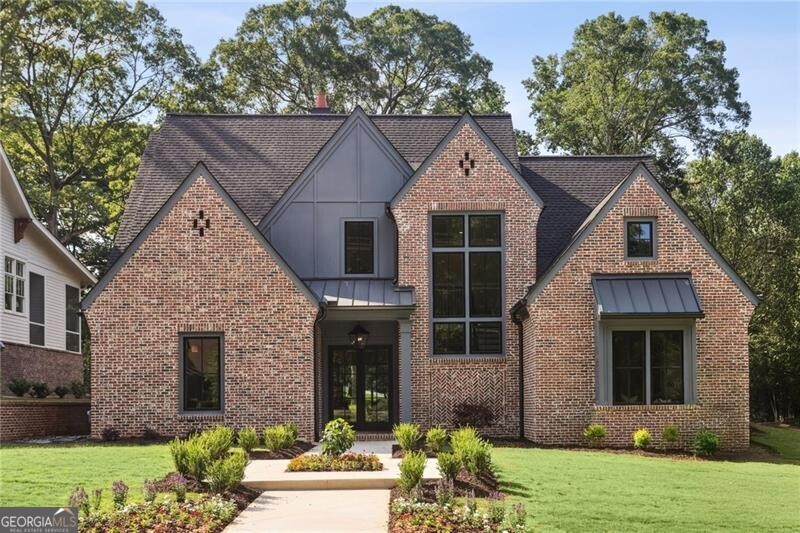 Absolutely flawless new construction near the Marietta Square, on the grounds of Marietta's oldest estate - Oakton. 5 Bedroom and 4.5 bath custom home on a beautiful flat lot, 3 car garage plus ample parking. Designer kitchen opening directly to a living space with fireplace which, in turn, opens to a fabulous covered outdoor space with a beautiful stone fireplace. Kitchen has full THERMADOR appliance package including a DOUBLE FRIDGE, gorgeous 48" gas range with double ovens and a custom hood vent, a pot filler, a built in dishwasher and a Kohler Fireclay farm sink. Scullery adjacent to the kitchen with tons of storace and a prep-sink, beverage cooler and Scotsman ice maker. Second bedroom on the main floor that could easily serve as an office and then 3 bedrooms plus a huge loft space upstairs. A SECOND bonus space above the garage that is reached through a separate staircase (and is already plumbed for bath or kitchenette). Builder: KISZ CONSTRUCTIONS, Jason Kisz. The Mountain to River Multi-Use Trails is right there along Kennesaw Avenue. Turn left and it's a quick trip down to Kennesaw Mountain National Battlefield Park. Turn right and the path leads directly to the Marietta Square and all the amazing restaurants, theaters and museums there.