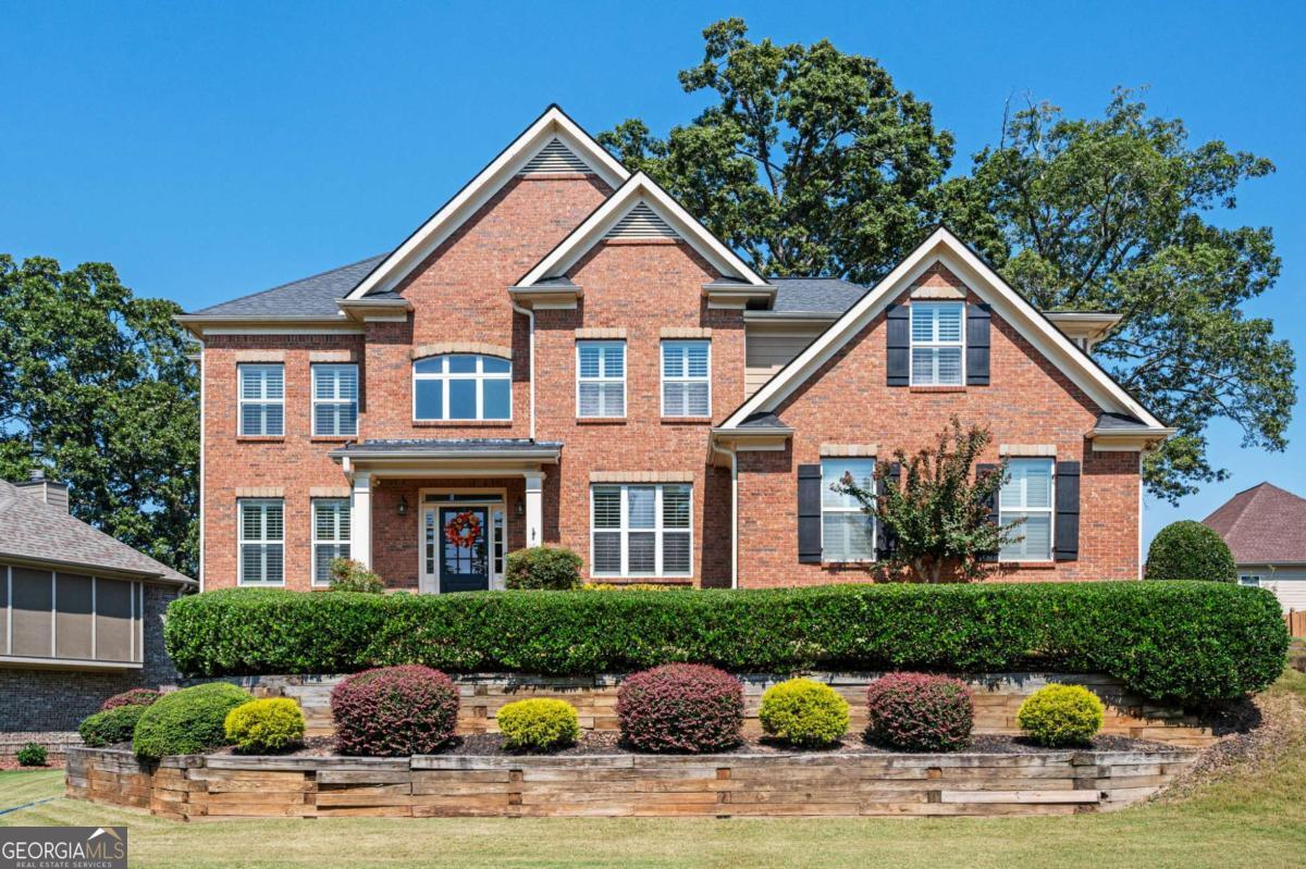 Entertainers Dream House! Huge kitchen with stainless steel appliances, granite countertops, tile backsplash, and kitchen island in addition to a breakfast area. Kitchen opens to the family room with a beautiful wall of windows looking over the in-ground pool, outdoor kitchen and fire pit. Grand foyer with hardwood floors and dining room with coffered ceiling. Bedroom and full bathroom on the main floor. Oversized primary bedroom with built ins, double trey ceiling, luxurious on suite with all the upgrades. Screened in porch perfect for your morning coffee or evening wine. Don't forget about the partially finished basement with rec room, media area, and a full bathroom. Unfinished area is perfect for storage/workshop or for potentially adding additional bedroom and square footage. Come see it today!