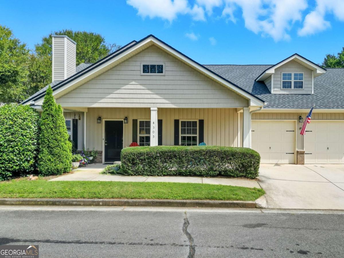 Charming 2-Bedroom Home in Concord Village - 55+ Active Adult Gated Community. Welcome to this beautifully updated 2-bedroom, 2-bath home perfectly positioned on a corner lot, this residence offers low-maintenance living with modern updates and a vibrant lifestyle. Step inside to find engineered hardwood floors (2022) flowing through the open-concept living space. The family room features a cozy fireplace and connects seamlessly to the spacious dining area and chef-inspired kitchen, complete with solid stone countertops, a large island with breakfast bar seating, an oversized pantry, and ample cabinet storage. The primary suite is a true retreat with custom his-and-hers closets and a luxurious ensuite bath featuring a large vanity and a separate shower. A generous secondary bedroom and additional full bath provide comfort for guests. Enjoy outdoor living on your covered front porch or the walkout patio overlooking the landscaped yard. The 2-car garage adds convenience and storage. Recent updates include: New roof (2025) New water heater (2025) New microwave (2025) New dishwasher (2024) and Fresh interior paint throughout. Designed with accessibility in mind, this home features wide interior doorways, making it wheelchair-friendly. Concord Village residents enjoy an array of amenities including a clubhouse, swimming pool, and social activities, all within a gated community. Ideally located close to shopping, dining, parks, and the Silver Comet Trail, this home combines comfort, convenience, and community.