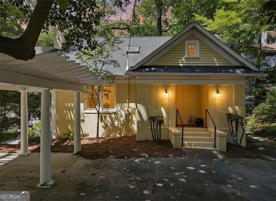 Tucked beneath mature trees in sought-after Peachtree Heights, this 1930s Craftsman pairs original character with smart updates and wooded privacy, right in the heart of Atlanta. Motivated seller-ready to make a deal. Step through the front door into a sun-filled living room anchored by a white brick fireplace and flanked by built-ins. Just off the living room, the sitting room offers a cozy space for conversation or quiet reading, while the formal dining room connects seamlessly to the kitchen. Solid-surface countertops, dark-stained cabinetry, and a gas range make the kitchen both functional and warm, with a nearby mudroom and pantry to keep things tidy and efficient. Two main-level bedrooms sit quietly toward the back of the home, each with its own closet and easy access to a full bath. A rear-facing sunroom with a wall of windows adds flexible space for work, play, or an afternoon recharge. Upstairs, every room is fitted with Velux rollout windows for natural light and fresh air. The spacious primary suite features a walk-in shower, soaking tub tucked under a charming sloped ceiling, and a massive walk-in closet that stretches over 25 feet deep, plenty of space to spread out and stay organized. Downstairs, an unfinished basement offers endless potential for storage or future expansion. Recent updates include a new furnace (2021), new AC (2023), and new hot water heater (2025). A wired alarm system and programmable exterior lighting add security and peace of mind. Out back, a terraced yard gives way to native landscaping, a storage building, and space to relax or entertain. The carport and extended driveway offer off-street parking for guests. Walk to the beloved Duck Pond, neighborhood pool, nearby parks, and the Saturday farmer's market. Minutes to Midtown, Buckhead, dining, shops, and trails, yet surrounded by trees and timeless charm.