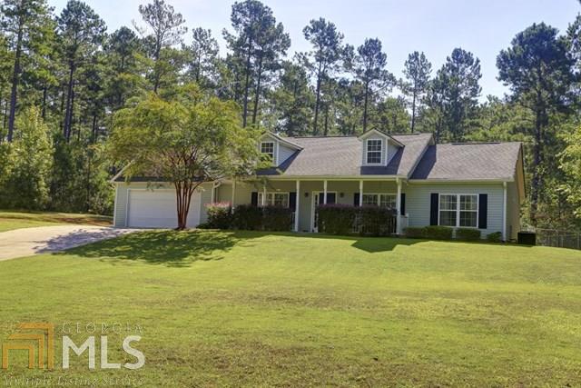 WELL-MAINTAINED RANCH HOME WITH A GORGEOUS LAKE VIEW ON 9 ACRES. Very quiet setting in eastern Heard County (Newnan address). Sit on the front porch and see the lake. This gated estate was constructed in 2005, has a big family room with vaulted ceiling w/gas fireplace. There's a smaller den or it could be an office, off the dining area. Tile floors in kitchen, dining, & breakfast area. Four bedrooms with carpet and ceiling fans. Attached garage w/kitchen entry. Fenced backyard w/fire pit for relaxing on cool nights. The home is clean and move-in ready. Come see this beautiful home!