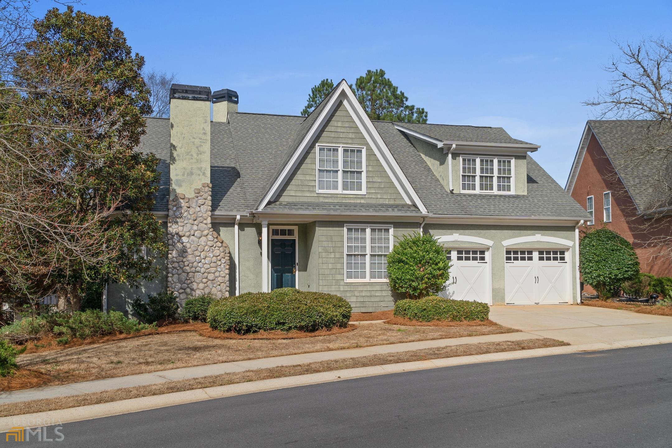 **Seller is offering $5,000 toward closing costs with a full price offer!** Welcome to your, new to you, home inside the gates at Eagles Landing Country Club! You are greeted with hardwood floors as you enter the foyer that flows in to the dining, half bath and kitchen. The kitchen has an eat in area, cherry cabinets with solid surface tops, double oven and a large island that overlooks the large great room with built-in cabinets/shelving and a fireplace. The large dining area will easily seat 10+ for all your family events. Also on the main level is the owners suite with laundry room and private access to the covered back deck. Upstairs you will find a bonus area that is perfect for an office, exercise room or man cave! There is a large teen suite with full bath as well as a 3rd bedroom and full hall bath upstairs. Make sure you check out the large covered back deck overlooking the backyard. The 2 car garage has a nice storage area as well. (Both AC units replaced 2022) This home is priced right for a nice place to live inside a Gated Community with access to Golf, Clubhouse, Swim and Tennis. 3 minutes to I-75 and shopping galore. Publix is 1 minute away from the main entrance.