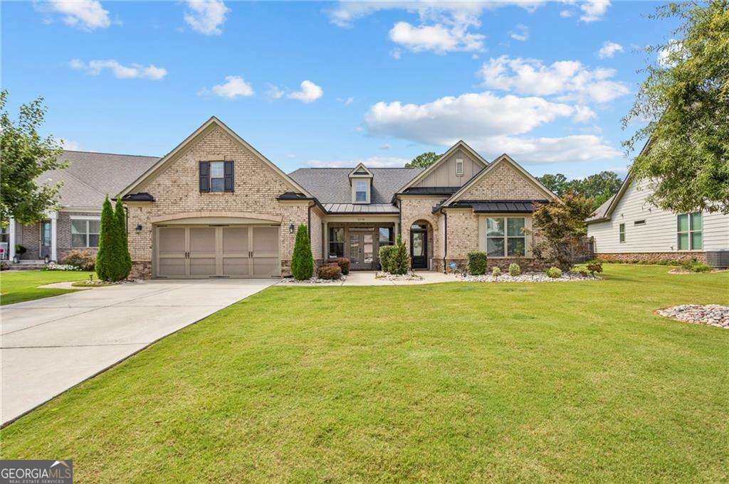Like-new construction home exuding Southern charm and hospitality in desirable Kyle Farm community! This beautifully upgraded stepless ranch has been carefully curated for comfort and style, from the inviting entryway to the thoughtfully designed interior, no detail has been overlooked. This open-concept layout features a spacious Great Room complete with a cozy fireplace and custom built-in bookcases for added storage, seamlessly flowing into a chef's kitchen, boasting an oversized island, double ovens, a gas cooktop, granite countertops, and a bright breakfast area - perfect for entertaining or everyday living. With 4 generously sized bedrooms there is space for everyone. The luxurious owner's suite showcases a striking accent wall and a spa-like bath with an oversized tiled shower with seating, a soaking tub, and 2 large walk-in closets. Step outside to your private flat, walkout, backyard oasis - relax in the hot tub under the covered patio or enjoy the extended patio and professionally landscaped, fully fenced yard. There's even a powered outbuilding for additional storage or workspace Additional features include an oversized garage with storage shelving, tankless water heater, whole-house water filtration system, upgraded lighting, ceiling fans, and custom wall accents throughout. Far from builder grade, thoughtful upgrades make this home truly one-of-a-kind. All located in the sought-after Kyle Farm community offering resort-style amenities: clubhouse, Jr. Olympic pool, splash pad, outdoor spa, volleyball & tennis courts, event lawn, and playground. Plus, you're in one of West Cobb's top-rated school districts and just minutes from shopping and dining! Do not miss this fabulous opportunity!