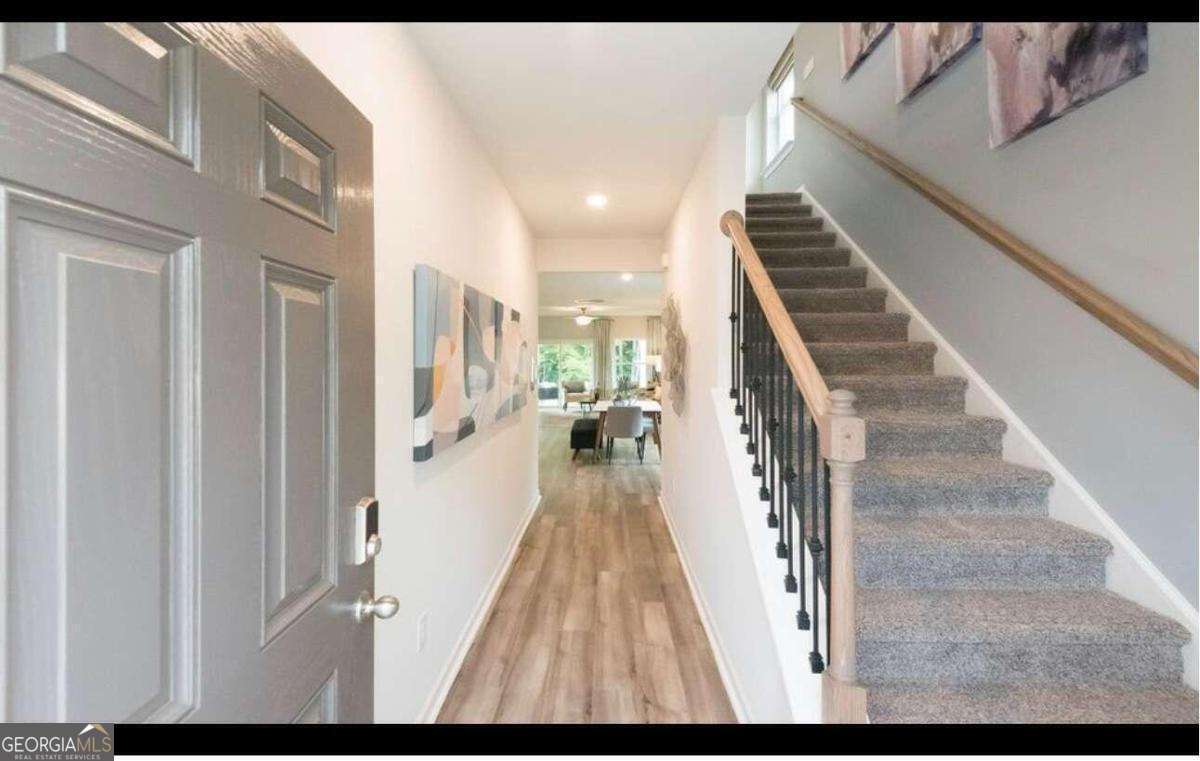 Just two years old, Great Location just off of I-575 Exit 11. Nearby Holly Springs Downtown. The energy-efficient home is ready. With Distinct Design Package. Host a gathering in the open-concept kitchen and living area. With five bedrooms, there's plenty of room to spread out. Personalize the upstairs loft to meet your needs. Dual sinks and a large closet elevate the primary suite. This neighborhood offers easy access to a host of shopping and dining options, including downtown Woodstock and The Shoppes at Atlanta. Schedule a community tour today and see the benefits of our energy-efficient two-story homes that boast features like multispeed HVAC systems, spray foam insulation, and high-performance air filtration. * Each of our homes is built with innovative, energy-efficient features designed to help you enjoy more savings, better health, real comfort, and peace of mind. Brand NEW energy-efficient home Just finished. open-concept kitchen and living area Upstairs, you can work and play in the loft and study nook. Linen cabinets with white quartz countertops, brown EVP flooring with creamy brown carpet in our Divine package. Just minutes from downtown Woodstock and downtown Holly Springs, this community offers easy access to a host of shopping and dining options. Homeowners will enjoy community dog park and green spaces as well as quick commutes to major employment centers and nearby highly-rated schools. pets Allowed.