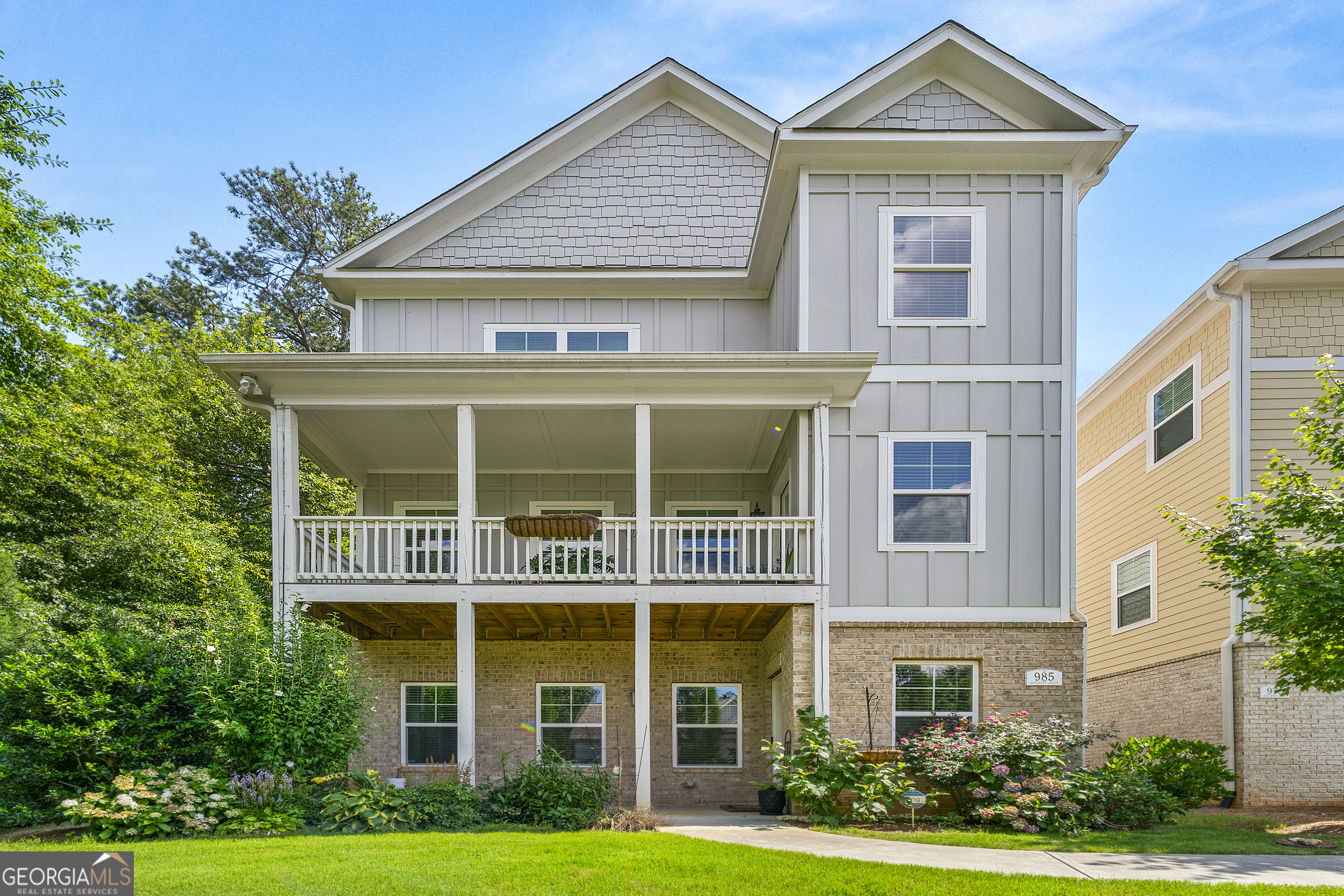 Elegant 4BR/3.5BA end-unit single family home in the desirable Marvelle community! This spacious home features an open-concept main level with a gourmet kitchen, oversized island, granite countertops, stainless steel appliances, and views to the living and dining rooms-perfect for entertaining. Upstairs offers a loft area, laundry room, and three generously sized bedrooms, including a luxurious primary suite with a double vanity, tiled shower, and walk-in closet. The fully finished basement includes a private bedroom, full bath, office nook, and large living space-ideal for guests, in-laws, or a home office. Additional highlights include a 2-car garage, hardwood floors, and a private end-unit lot with peaceful treetop views. Enjoy low-maintenance living just minutes from Marietta Square, I-75, and Truist Park. Seller is eager-bring your best offer and close quickly!