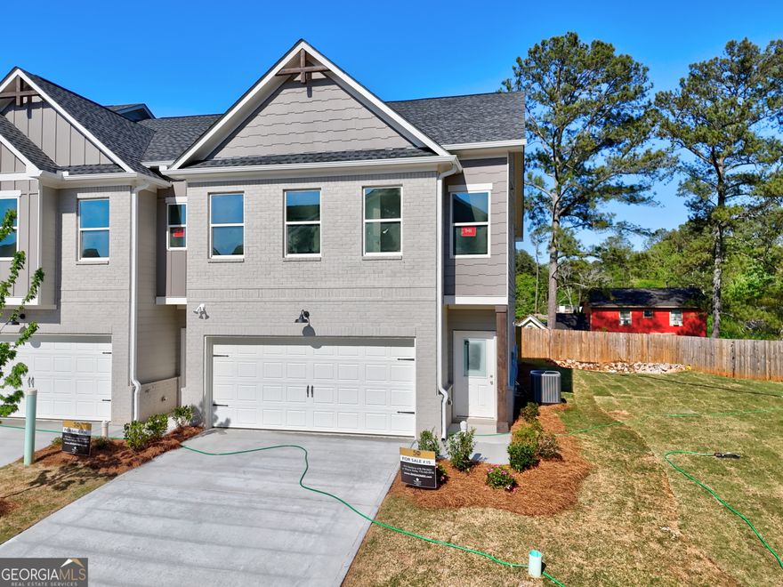 Richardson Housing Group - The Evergreen 4-bedroom END UNIT floor plan with covered screened-in back porch. Located in the upscale, gated community of Rockfern Place in Norcross, GA, our community offers convenient access to various amenities and attractions. Situated just 14 miles northeast of Atlanta and only 2 miles from I-85, residents can easily reach Downtown Norcross, Old Town Lilburn, shopping, dining, restaurants, parks, and city events. Our homes are designed to be low maintenance and energy-efficient, and they proudly carry the Right Choice designation. Our homes showcase contemporary cedar accent and painted brick exterior designs and incorporate modern design elements such as electric vehicle charging outlets, stylish kitchens with quartz countertops, stainless appliances, modern shaker-style cabinets, and enlarged fully tiled master showers, among other amenities. At Rockfern Place, we are pet-friendly, and your canine companions are welcome to explore our fenced-in "Bark Park" within the community. The homeowner's association dues cover lawn maintenance, termite bond, and certain exterior building maintenance, ensuring a hassle-free living experience. The main photo is of the actual unit listed for sale, and the watermarked "Stock Photos" showcase the same floor plan from previous builds. Please note that features, options, upgrades, and colors in the stock photos may vary from the actual unit for sale. $10,000 or more in closing cost incentives on this home when working with an approved lender; also, ask us about a 1% below market interest rate or 100% financing with our approved lenders!