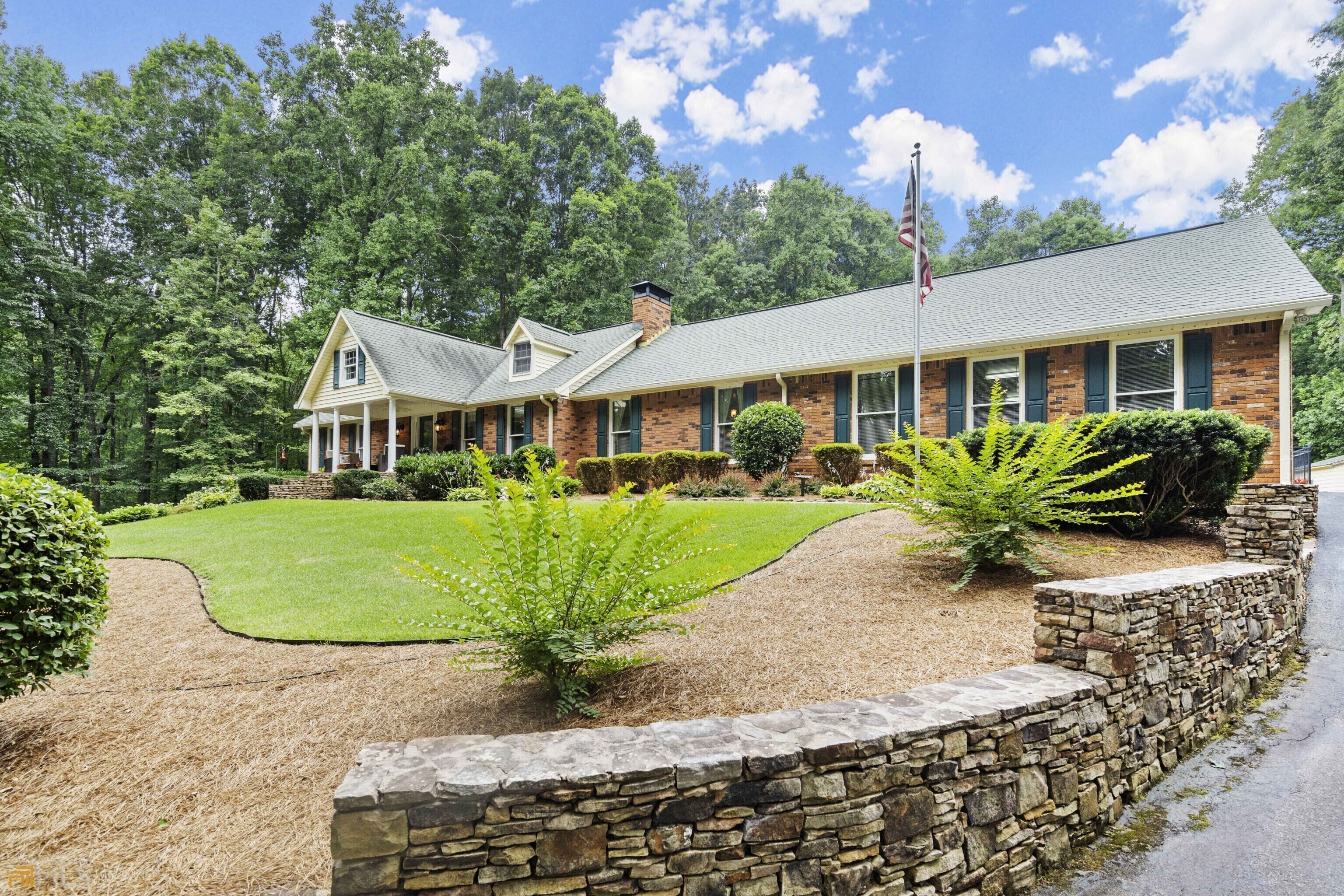 Buyer's lender failed to perform. Appraisal above list price. Now is your chance! Privacy, peace and quiet await you on 7+ acres with your own pool, vegetable garden and workshop. This brick ranch is surrounded by old growth hardwoods and sits well off Brinkley Road to provide the perfect retreat that is still convenient to all that you need. As you wind through the forest up the driveway you will pass ample parking for entertaining, beautiful fieldstone walls, mature and manicured landscape and arrive at the three car garage with an oversized parking pad for more options. The stone entry steps and covered front porch welcome you to the open, fireside family room. Relax in the sunroom or use it as a private office overlooking the pool. Prepare you meals in the warm kitchen that provides plenty of stone counter space, ample cabinets and a casual dining space. Formal meals are well served in the banquet size dining room. The main level offers an en-suite bedroom, secondary bedroom and hall bath. The terrace level offers a full kitchen as well as a spacious bedroom suite and bath with double vanities, a step in shower and soaking tub. Step out back to the private pool with plenty of seating and grilling space that overlooks the secluded back yard and garden area. The detached garage space can flex into a hobby workshop or a wonderful garden potting shed. Mature hydrangeas, roses and other annuals provide the right color for each season. You even have a half bath that is accessed from poolside to avoid all the wet feet inside!