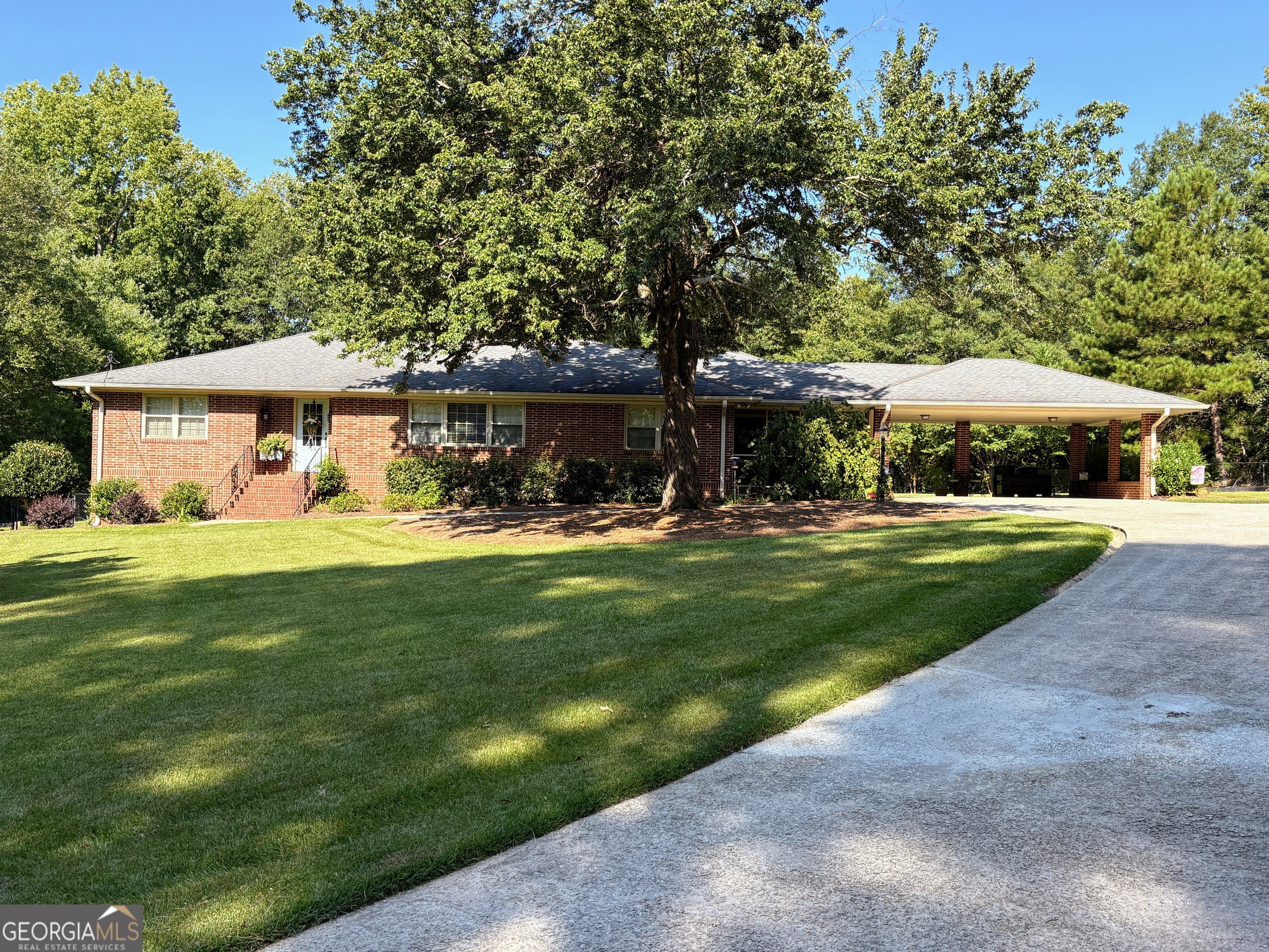 Welcome Home to this Immaculately maintained 4 Sided Brick rambling Ranch style home in the Heart of Douglasville. This classic home offers spacious living on a one+ acre lot. A Formal Foyer sets the tone leading to the Living and Dining Rooms, A Modern Chef's Kitchen and Family Room which overlooks the backyard. Enjoy outdoor living from the front of the home while sitting inside the cozy screened porch OR from the backyard from the deck OR poolside. The private pool awaits with generous decking for sunning and entertaining. Don't miss the additional building in the backyard. Perfect for Man Cave/She Shed or Pool house or Multigenerational needs! Step back inside the home to the 3 well appointed Bedrooms, Updated Bathrooms and an Unfinished Basement.