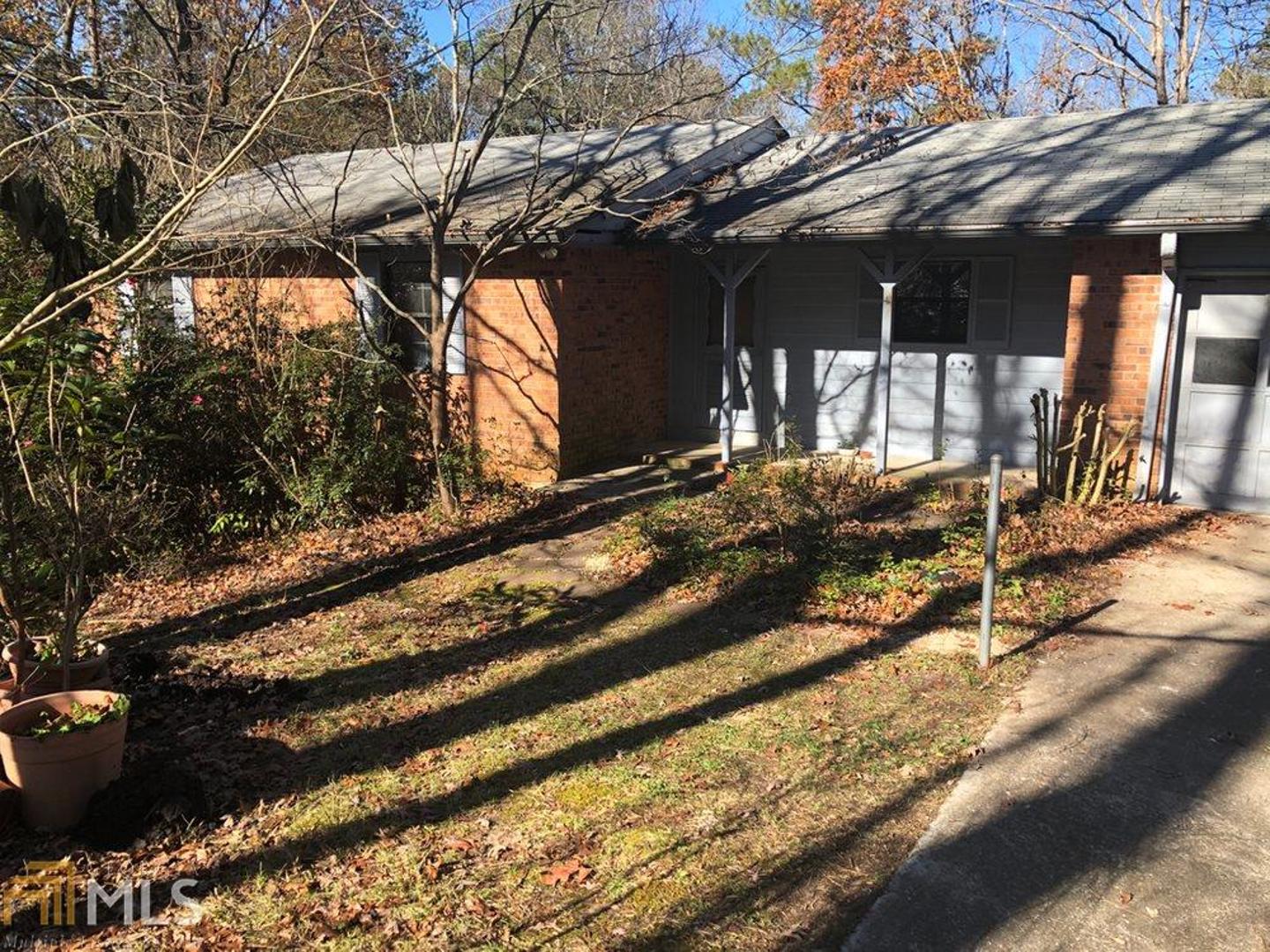 3 BR/2 BA home in convenient North Rockdale community. Needs some TLC. 4-sides brick with wood accents. Wood, vinyl and tile floors. Large laundry room off of the kitchen. Wood-burning stove in family room. Large bedrooms with big closets. Master with ensuite. Huge basement needs finishing touches. Large lot with beautiful nature views. Price reflects needed repairs.