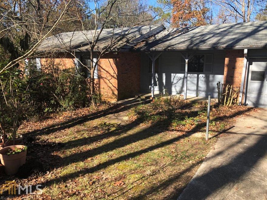 3 BR/2 BA home in convenient North Rockdale community. Needs some TLC. 4-sides brick with wood accents. Wood, vinyl and tile floors. Large laundry room off of the kitchen. Wood-burning stove in family room. Large bedrooms with big closets. Master with ensuite. Huge basement needs finishing touches. Large lot with beautiful nature views. Price reflects needed repairs.