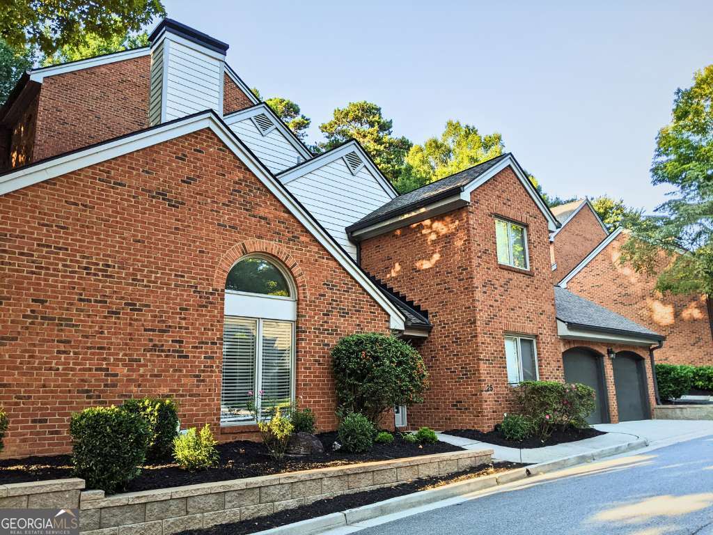 Beautifully Remodeled Brick Townhome with Master on Main! Rare Opportunity in Sandy Springs - Don't miss this rarely available gem tucked away on a quiet, tree-lined street in the heart of Sandy Springs' sought-after Perimeter area. This charming all-brick; townhome blends timeless elegance with modern upgrades. Natural light pours in from three sides of the home- a rare luxury for a townhome that only shares one brick wall with the neighboring property- creating a bright, airy atmosphere that truly feels like a single-family home. Step inside to discover spacious, light-filled interiors, fully remodeled with 3 large bedrooms, 2.5 baths, and soaring 9 to 14 ft ceilings on the main level. The versatile master suite on the main floor offers a gas fireplace and can easily function as a dramatic formal dining space if desired. Upstairs, you'll find two generously sized bedrooms, 8 ft ceilings, and a bonus loft area perfect for a home office, gym, or creative space. Unique architectural features set this home apart: arched doorways, built-in bookcases, a cozy coffee bar nook, and a sunken living room with a second gas fireplace - creating warmth and character at every turn. Natural light pours in from three sides of the home, a rare luxury for a townhome. Enjoy the convenience of a 2-car garage with updated door mechanisms and relax knowing you're part of a well-maintained community with low HOA fees that still deliver exceptional service and upkeep. Located just minutes from top shopping, dining, and entertainment in the vibrant Perimeter area, this home offers the perfect balance of quiet residential charm and urban accessibility. Highlights: Turnkey/Fully remodeled 3BR / 2.5BA Master suite on main (or use as dramatic dining room) 2 gas fireplaces Bonus loft space Natural light from 3 sides, feels like a single family home Built-ins, arches, sunken living room, coffee nook 2-car garage with new SMART door remote system Quiet, tree-lined, cul-de-sac street Low HOA fees with high community standards. Prime location in Sandy Springs, 30328. This unique home won't last long - schedule your private showing today and see why it's one of the best-kept secrets in Sandy Springs! New HVAC System 2020 | New Hot Water Heater/Expansion Tank 2021 | New Stainless Steel Appliances 2021 | Entire Community HOA Architectural Shingles Roof Replaced 2020 | Monthly HOA fees include: water, landscaping, garbage/recycling, reserves, exterior insurance, termite bond, pest control, community gutters cleaned twice a year, street maintenance.