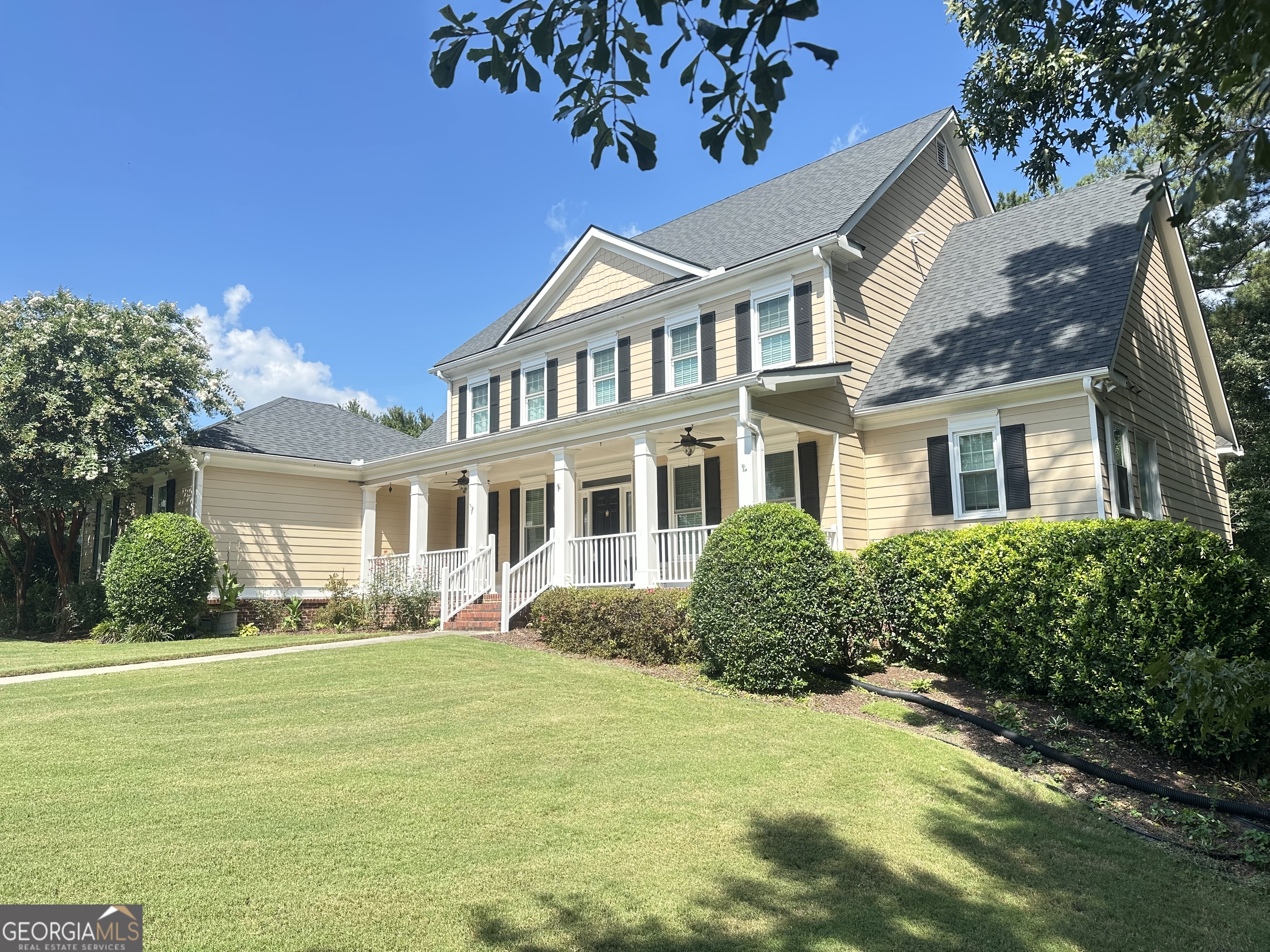 Welcome home to your lakeside retreat! This Two Homes in One gem is move-in ready and designed for both comfort and convenience. With 5 spacious bedrooms, 4 full and 2 half baths, 2 full kitchens, and 2 laundry rooms, this home offers unmatched flexibility for multi-generational living, entertaining, or hosting guests. All of this comes with a beautiful view of the lake, a private yard, and your own dock for the perfect waterfront lifestyle. From the inviting rocking chair front porch, step inside to discover an elegant traditional floor plan. To the right, a cozy office/reading room with fireplace offers the perfect work-from-home retreat, while the left side welcomes you with a formal dining area ideal for gatherings. Both spaces showcase rich hardwood floors, including brand-new hardwood flooring in the living room that adds warmth and style. This home has been thoughtfully updated throughout: enjoy new upstairs carpet, a fully remodeled master bathroom and walk-in closet, brand-new windows, an updated chef's kitchen with modern finishes, and a brand-new basement A/C system for year-round comfort. Every detail has been carefully maintained and upgraded to ensure a home that feels fresh, modern, and ready for its next chapter. Whether you're enjoying quiet mornings on the porch, entertaining lakeside, or relaxing in your beautifully updated owner's suite, this home offers the perfect balance of luxury and livability. Truly move-in ready - all that's missing is you.