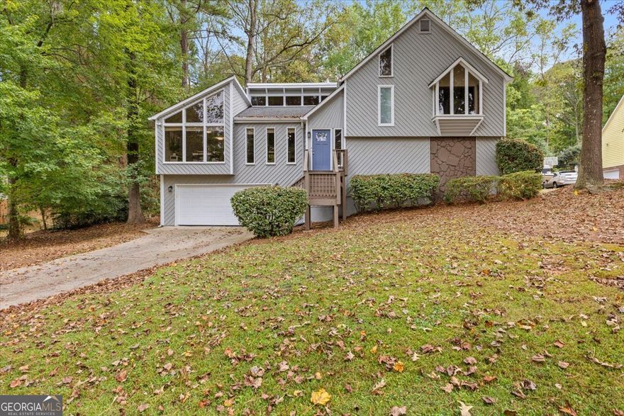 Located in the highly sought-after Liberty Ridge subdivision, this updated 4-bedroom, 3-bath home offers the perfect blend of timeless charm and modern upgrades. With approximately 2,266 square feet of well-designed living space, this home is ideal for families or anyone seeking comfort, convenience, and style.    Step into the spacious vaulted great room, highlighted by a stunning granite fireplace-perfect for relaxing or entertaining. The bright, open kitchen features white cabinetry, granite countertops, and a subway tile backsplash, making meal prep a breeze.    Enjoy outdoor living with two private rear decks and a built-in fire pit in the backyard-great for weekend gatherings or quiet evenings under the stars. The finished daylight basement offers a flexible space ideal for a teen suite, guest quarters, or home office.    Located just minutes from top-rated schools, shopping, dining, and East Cobb's best parks, this move-in-ready home checks all the boxes.    Don't miss this opportunity-schedule your showing today!