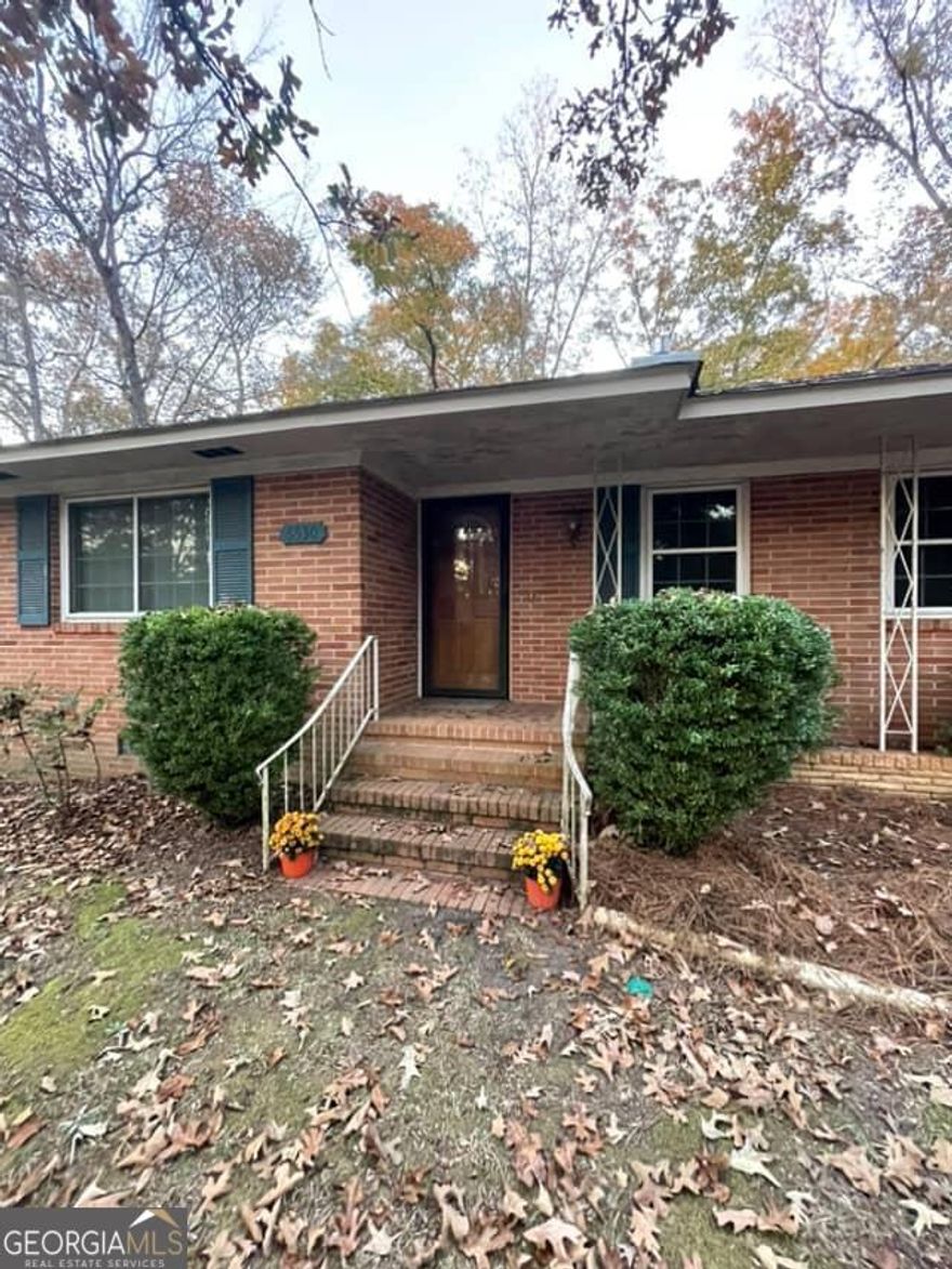 This well maintained and loved home was the very first built in the Rutland Community and on the most beautiful lot! Built by the family who developed the Bevinwood subdivision & is named in their honor, this solid 2,204 square foot brick home sits atop a spacious shaded lot overlooking Bevin Drive. The helpful circular driveway leads to the home & offers plenty of parking and ease of access. A 2 car attached carport is attached off the kitchen with a large laundry room close by! You will love the inviting kitchen with beautiful custom built oak cabinets! So much helpful organization to this kitchen throughout every detail of cabinetry with great pantry space! A cozy 2nd living room next to the kitchen has a fireplace with a wood burning stove neighbored by generous built-in bookshelves to both sides of the fireplace. This living space opens up to an adjoining room with lots of windows overlooking the large backyard. A handicap accessible ramp leads to this door giving ease of access for others and also helpful for moving furniture into the home! The front of the home has an inviting foyer with parquet floors and opens up into a large front living room with adjoining separate dining room. There are 3 bedrooms and 2 bathrooms off the hallway and all bedrooms have very nice original hardwood floors! A walk-in storage closet is located on the hallway perfect for storing decorations or linens. The master bedroom has 2 closets with a built-in dresser ideal for not taking up extra floor space! The master bath contains a double vanity along with a cast iron tub/shower combo. A lot of attention has been paid to the home over the years with upgrades such as the water heater, all windows replaced, commercial grade electrical panel, new blinds and 12 year old roof. Schedule a showing at this lovely Bevinwood home today!