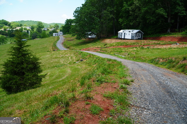 Peaceful Meadows spans 28 acres and will feature 78 Titled Park Model RV homes at completion. Residents enjoy a peaceful, community-oriented lifestyle with modern amenities including paved roads, water, septic, high-speed internet, and professionally maintained landscaping in shared green spaces. Future amenities under development include: * Gated entrances * Clubhouse with fitness room & pavilion * Picnic area * Pickleball court * Dog park Active Construction Site, please use caution when visiting. Only Tiny Life homes may be purchased and moved to this lot/community. Other lots available for purchase.