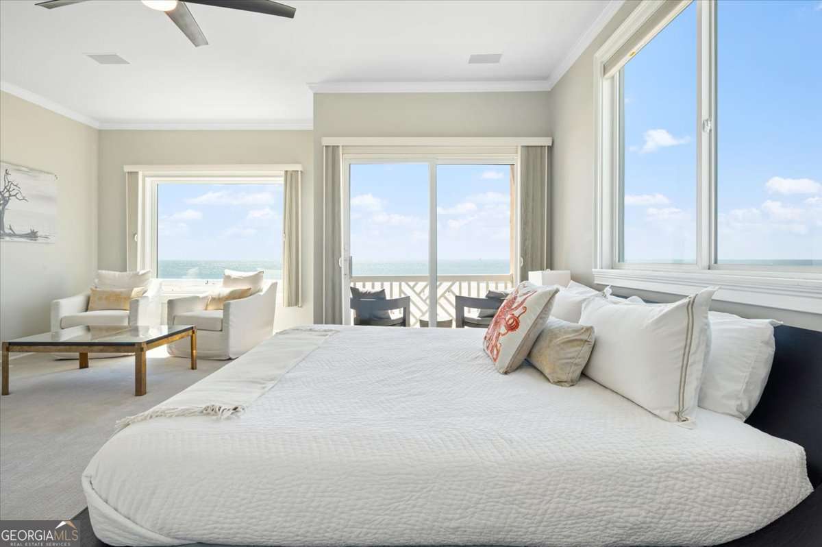 Your oceanfront destination awaits in this location of a lifetime space, where surrendering to the sweeping vistas of the Atlantic Ocean is the only option. It's this STUNNING view that has our vacation rental tenants returning year after year. Being sold fully furnished, it's the perfect addition to your real estate portfolio as well as one of the most gorgeous retreats to carve out some time for you and yours to recharge and renew. Whether sipping your morning coffee on one of the two balconies or enjoying the fresh air on the lower level terrace, the panoramic views and ocean breeze are simply unmatched. Step inside to discover a beautifully renovated and well appointed home where modern elegance meets coastal charm. Every detail has been thoroughly designed to create a relaxing, luxurious atmosphere from the high-end finishes to the carefully curated furnishings. The spacious, open concept living area flows effortlessly through the three floors of living space. Large windows invite an abundance of natural lighting offering a stunning ocean view from virtually every room. The gourmet kitchen features top-of-the-line stainless and gas appliances, sleek countertops, and ample meal prep space. The living area peeks through the dining area and into the kitchen creating the ideal environment for gathering and unwinding after a day of island exploration. Each of the four bedrooms, two which offer the convenience of ensuite, is the perfect retreat at the end of the day. Geographically, on the South end of the island, find yourself just minutes away from the best shops, restaurants, and attractions. Combine the stunning, expansive views, with the unencumbered, private beach access, with the ideal location; and, see your Beach House dream fully realized. "Life is short, buy the beach house"...it's time to make it happen.