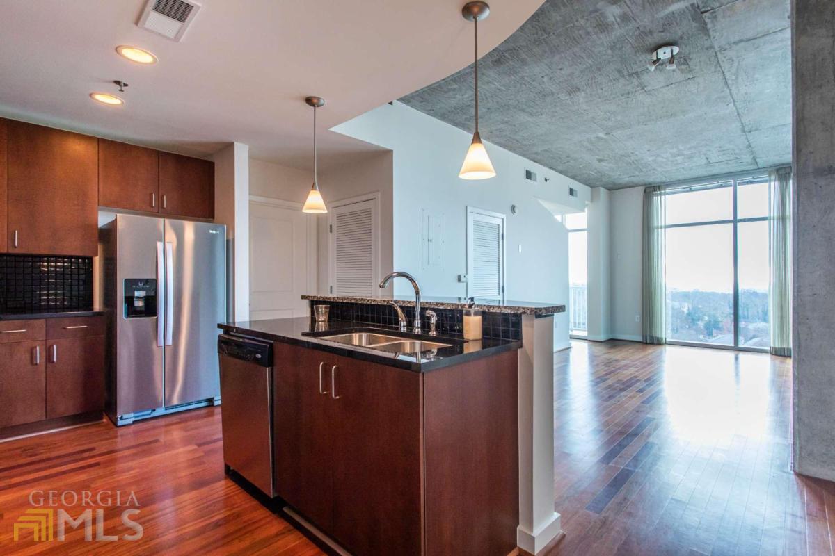 Take in this beautiful Skyline view from your living area and bedroom. City living at its best with shopping, restaurants, transportation and outdoor activities right out your front door or within minutes. Unit has walls of windows on two sides for different views .Kitchen has granite bar/island and countertops. Stainless appliances. Washer/dryer come with the unit .Parking space is on level as the unit and close to the door .Extra storage comes with the unit. Building has fantastic workout facility, outdoor pool, indoor entertaining space, and outdoor patio.24 Hour Concierge in main Lobby area. Very Secure living.