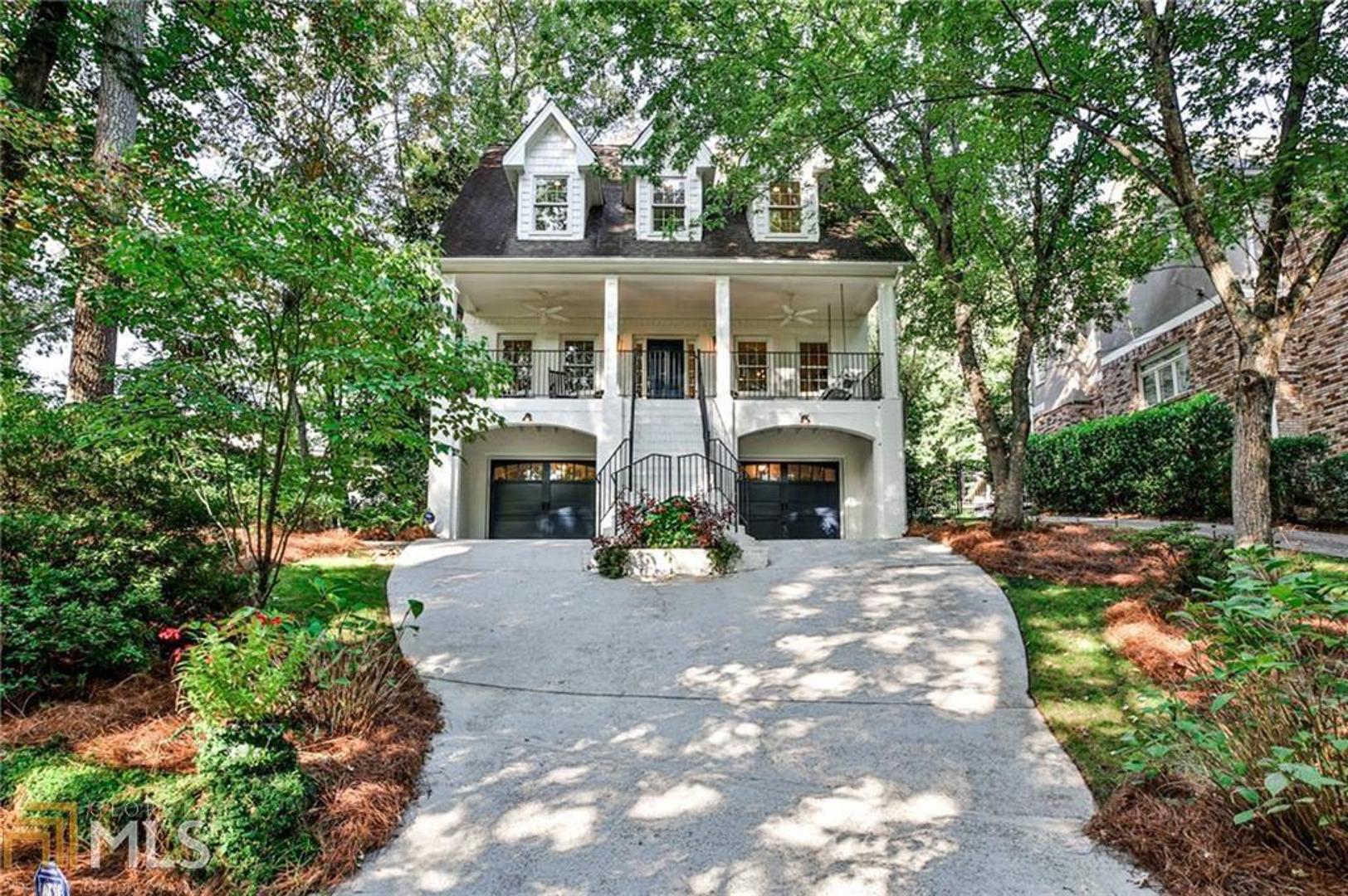 Southern charm at its essence. 3-story custom brick perched among the trees on serene Seneca St, overlooking Waddell Park and nestled in the heart of the City of Decatur’s coveted Great Lakes neighborhood & award-winning school district. A hidden oasis in the city, this treehouse is a tranquil retreat steps from the many conveniences of city living. Walk Everywhere¬—Downtown Decatur, Glenlake Park (w/playground, pool, tennis & dog park), Decatur Cemetery (58 acres of greenspace), Clairemont Elementary, public transportation (including MARTA) & endless dining/retail options. An entertainer’s dream unlike anything you’ve seen, this home offers 3,480 sf of architectural distinction in an airy, light-filled sophisticated setting with elegant moldings, newly refinished hardwoods & custom built-ins throughout. You’ll adore the open concept living with its thoughtful detail & versatility of use. Enjoy panoramic morning views of lush greenery & well-earned nightcaps on the peaceful rocking chair front porch. Impress dinner guests with the dining room view while effortlessly moving through the adjoining butler’s pantry, wet bar & updated eat-in chef’s kitchen. Watch jaws drop when guests glimpse the thick-slab Carrara marble bar & countless kitchen/family room delicacies. Open the French doors and step into your exquisitely landscaped backyard sanctuary, where you’ll entertain with ease under the cathedral-shaped pergola. Partake in fall’s finest, from watching football on the stacked stone wood-burning fireplace, to grilling brats on the Green Egg in your custom outdoor kitchen. Transform yourself to Cashiers in the rear garden with its pristine pondless waterfall & firepit. Inside, you’ll find 4 upstairs bedrooms including a luxurious owner’s suite with spa-like bathroom & large WIC. Finished basement with den & private in-law suite steps off the 2-car garage/workshop. Storage space abound. Newer HVAC system. Freshly painted interior/exterior. New front banister, handrails & garage doors. Minutes to Emory, CDC, Agnes Scott, VA Hospital, Emory Decatur Hospital & major highways. Perfectly poised and beaming with warmth, this home embodies the essence of classic Southern charm!
