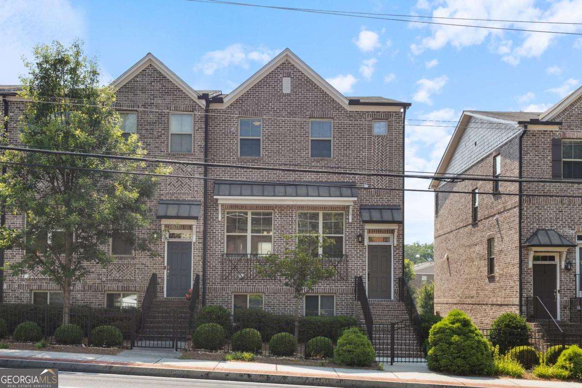 Bright, Stylish & End-Unit Convenience Welcome to this 3-sided brick END-UNIT townhome in a sought-after community, where classic charm meets modern ease. Inside, enjoy a bright open layout with hardwood floors, a spacious dining area, and a sleek kitchen with stainless steel appliances, granite island, and tons of cabinet space-perfect for cooking and hosting. The main level features a cozy living room with a fireplace and a guest powder room. Upstairs, you'll love the oversized, upgraded master closet. Need a private guest suite or home office? The terrace-level 4th bedroom has a full bath and generous closet space. Community amenities include a charming outdoor fireplace, grilling area, and guest parking. Just minutes from Brookhaven, Buckhead, Emory, and MARTA-with quick access to I-85 for easy commuting.