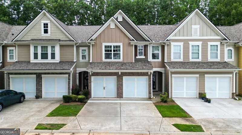 Welcome to a gorgeous townhome available now in the sought after Ellison Lake Townhome community with a LAKE VIEW-RIGHT ACROSS THE STREET! This home has been upgraded and well maintained by the owner and is Fee Simple ownership and offers the lovely feel of a single family home but without the upkeep - the HOA handles all of the lawn maintenance and you just get to enjoy the array of amenities - easy and convenient living! The main level features a 2-story foyer with 2 display niches, a beautiful chandelier and hardwood stair treads, large fireside great room, open concept dining room, and the kitchen overlooks the great room! Don't miss the large storage closet in the foyer and guest bathroom! Stunning LVP flooring on entire main level, newer light fixtures and 2" blinds! Upgraded fiberglass front door and door to garage with blinds between the glass! Kitchen features granite countertops with stainless steel appliances and an undermount sink and disposal! Refrigerator is included! The dining area features a chair rail, detailed trim and glass doors leading to a private patio! Laundry room is the perfect mud room leading into the kitchen from the garage! Upstairs features an open bonus/loft/flex space-endless possibilities here, all with gorgeous LVP flooring! The spacious owner's suite features a cathedral ceiling with 2" blinds! The ensuite bath features vaulted ceiling, walk-in closet, double vanity, large soaking tub, separate shower and private water closet! There are 2 additional spacious bedrooms and additional bathroom on this level! Brand new ceramic tiled floors in both bathrooms - stunning! Take note-.New Roof and Water Heater! Don't miss this great home, just minutes to all the amenities of Kennesaw, Acworth and Marietta, including great shopping, restaurants, KSU, Kennesaw Mountain National Park, walking and biking trails! Ellison Lakes offers awesome amenities: Lake, Clubhouse, Fitness Room, Swimming Pool, Playground, Sidewalks.